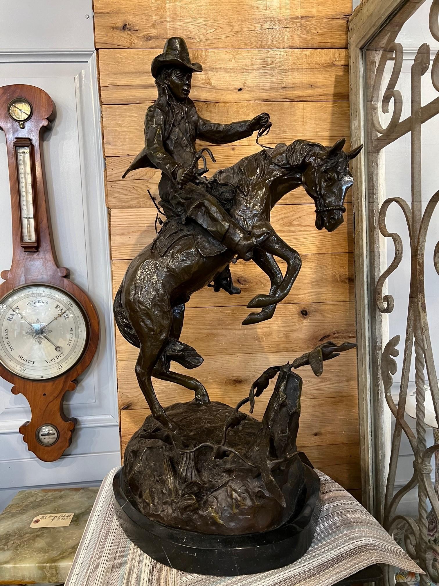 Late 20th century bronze cowboy on a rearing horse signed Jim Davidson. This is a good looking piece with the cowboy on a rearing horse and birds in flight from the ground. Most likely from the late 1980s when the reproduction bronzes were very good