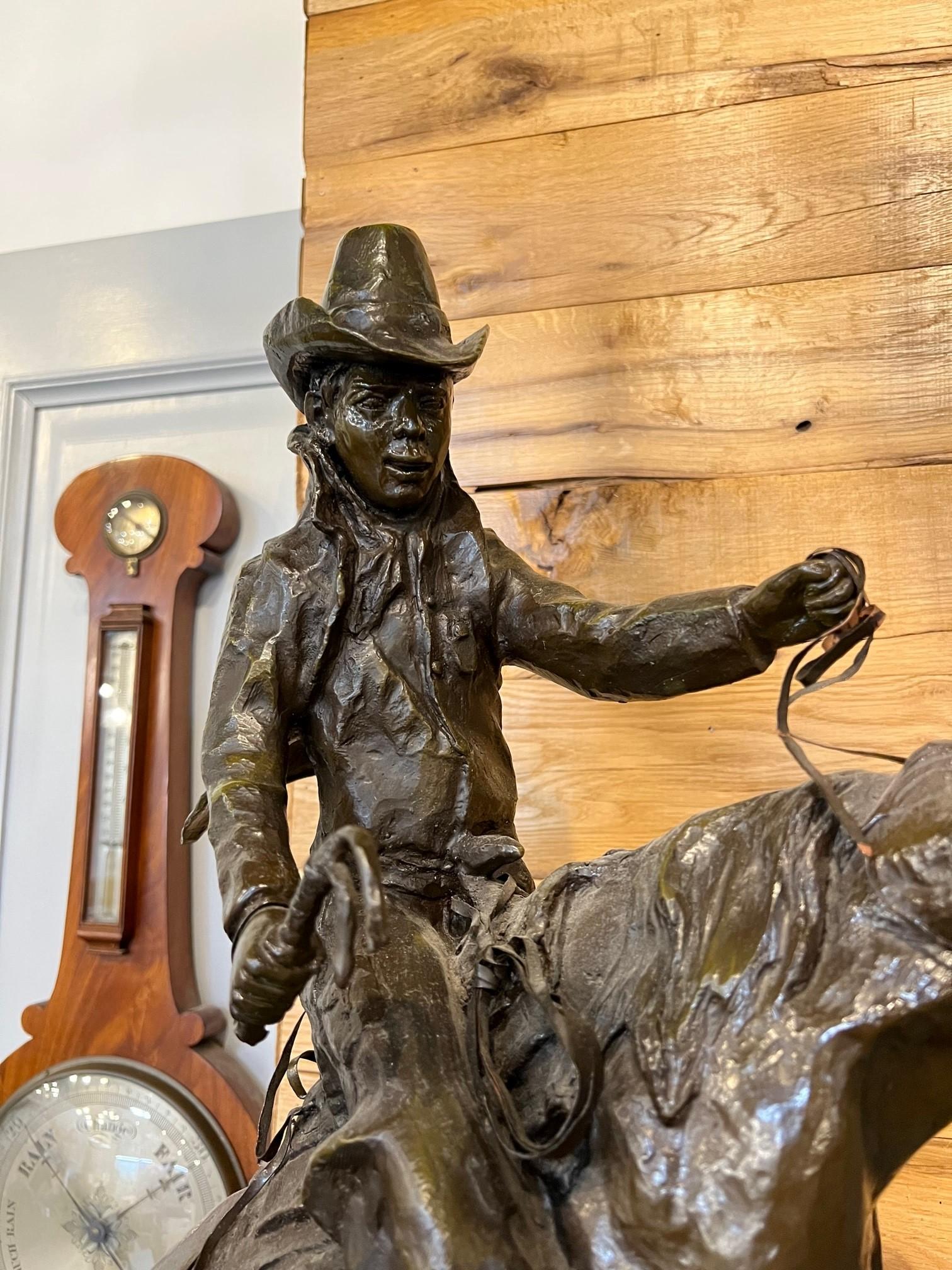 Cast Late 20th Century Bronze Cowboy on a Rearing Horse with Birds and a Marble Base  For Sale