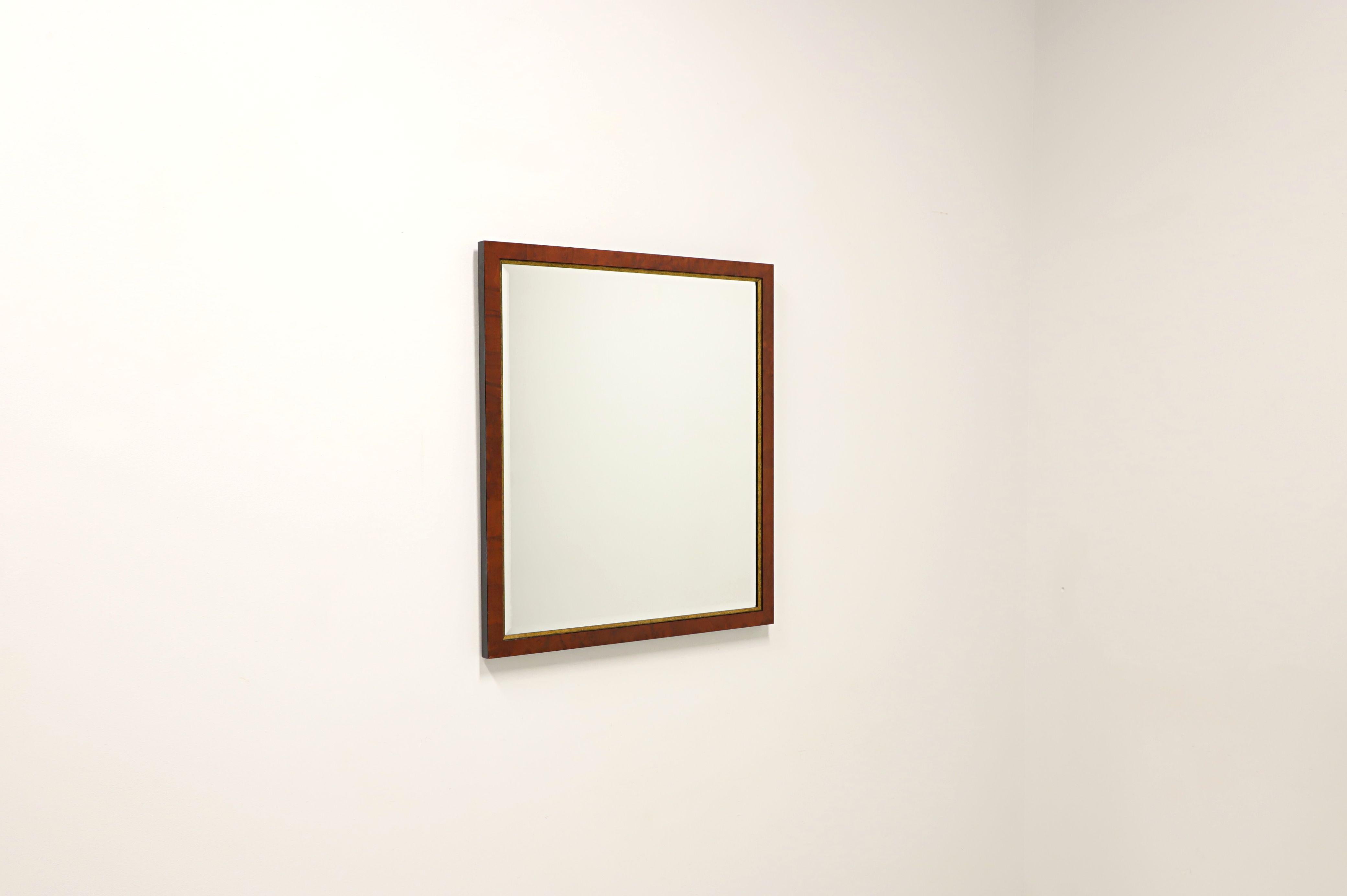 A Traditional style rectangular wall mirror, unbranded. Beveled mirror glass in a burl elm frame with gold trim around the mirror edges. Framed in Lenoir, North Carolina, USA, in the late 20th Century. 

Measures: 30w 1.25d 34h, Weighs