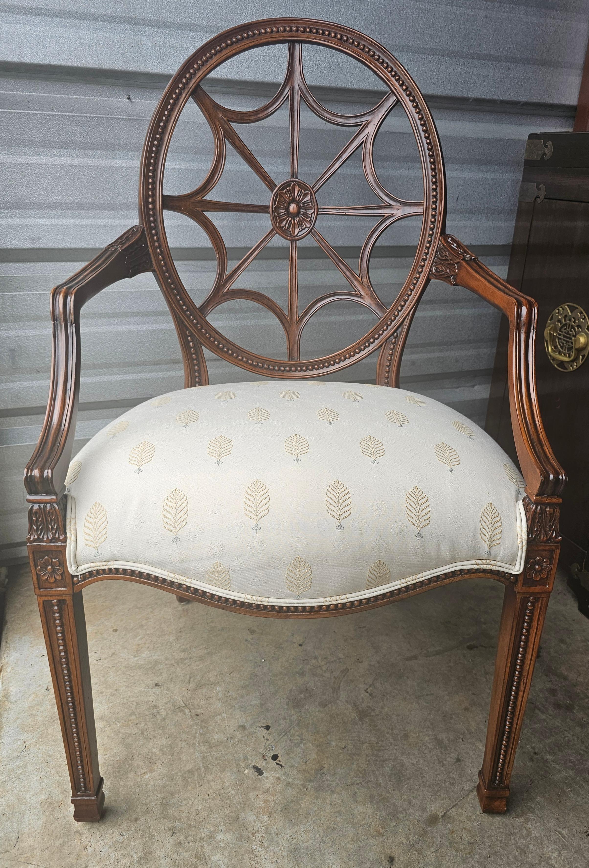 A Late 20th Century Carved Mahogany Spider Back Armchair with intricate carvings and clean luxurious cream color Upholstered Seat. Great as a dining chair as well as desk chair. Measures 24