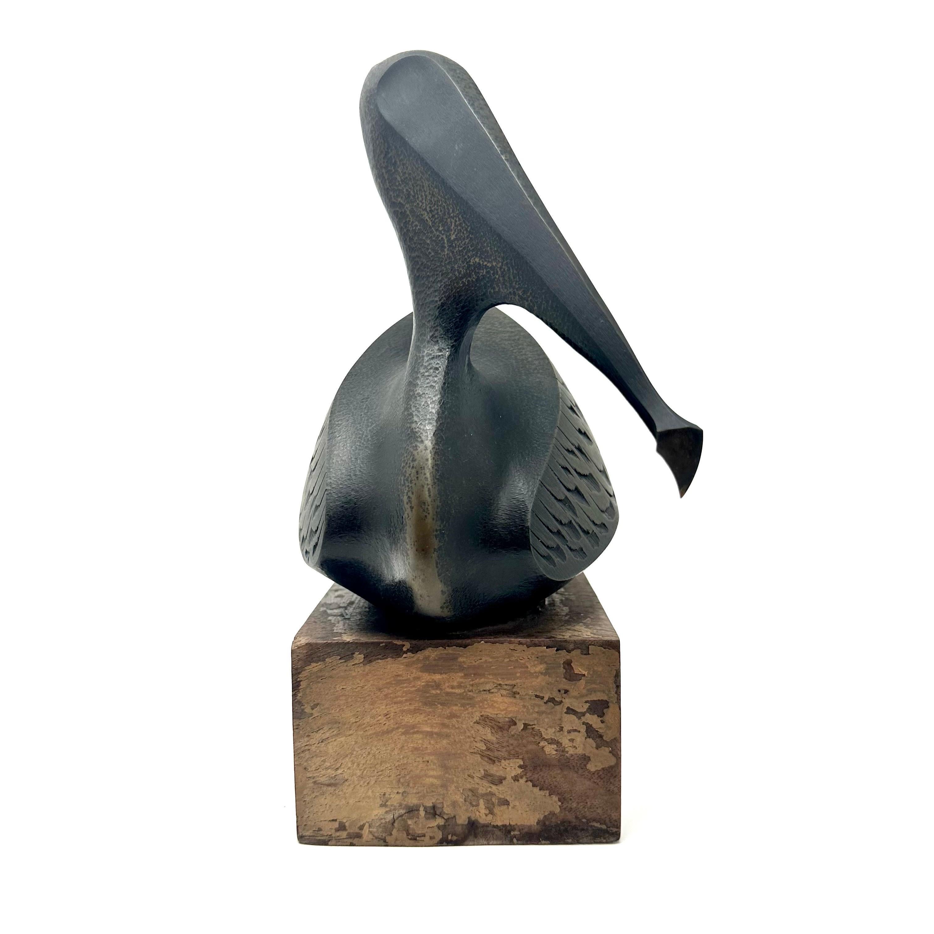 Late 20th century cast bronze pelican sculpture on wood base by California artist Douglas Purdy. The piece is marked on the underside of the base, and numbered 80/200. The sculpture depicts an abstracted pelican, and is in excellent