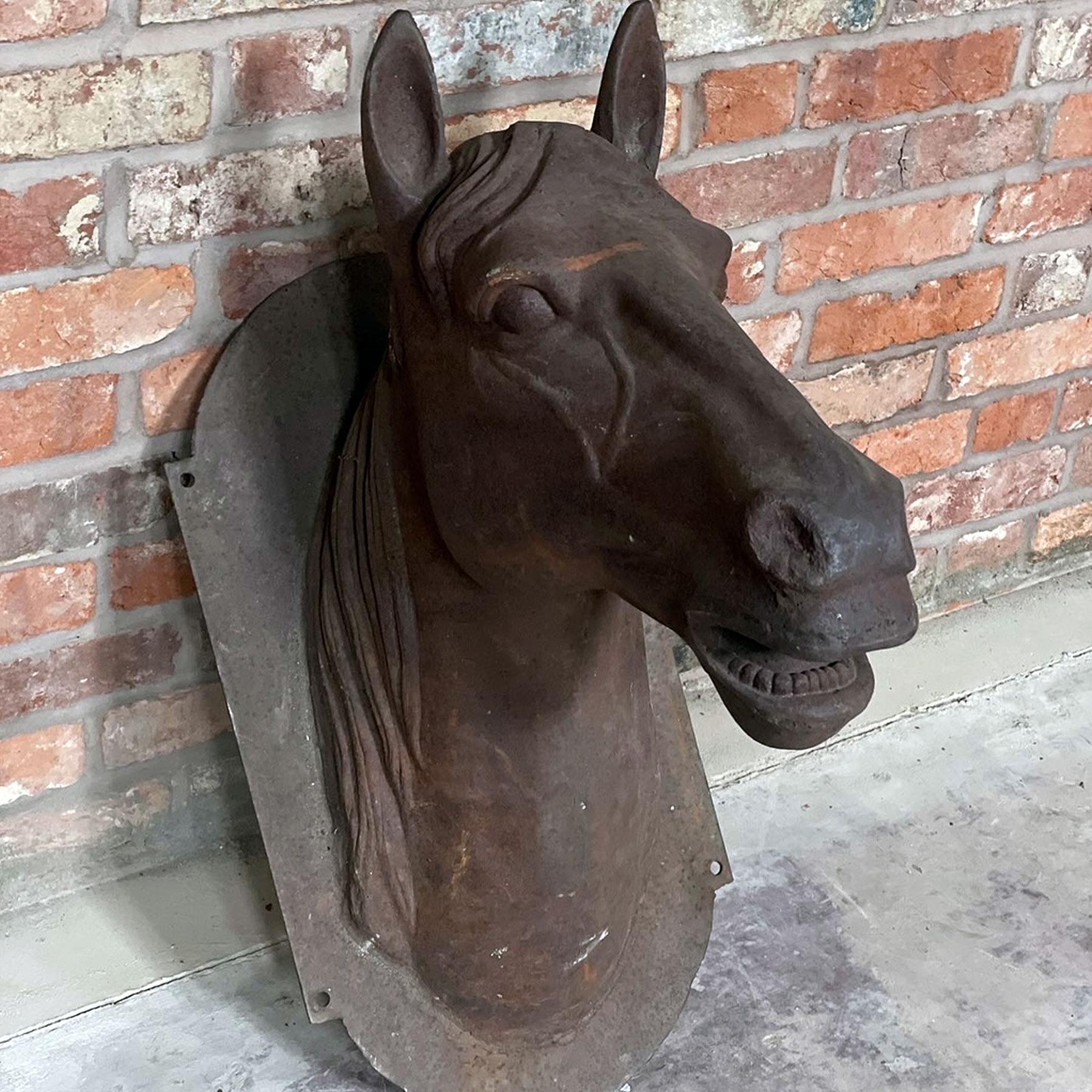 A late 20th Century Cast Iron Wall mounted Horse head could make a very nice addition to your garden or perhaps your stables?.