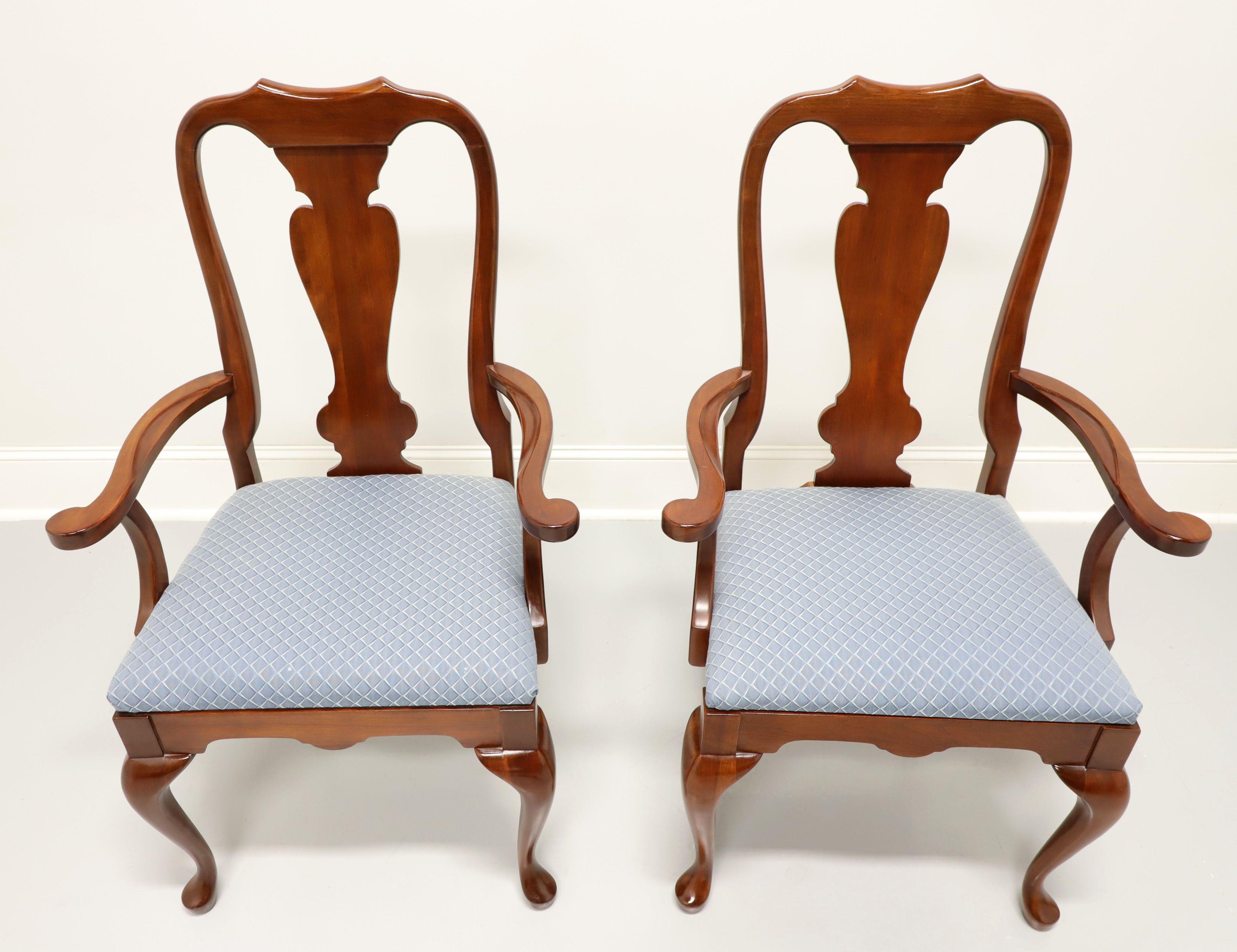 A pair of Queen Anne style dining armchairs, unbranded, similar quality to Hickory Chair. Solid cherry with carved crestrail & backs, curved arms, blue patterned fabric upholstered seats, cabriole legs and pad feet. Made in the USA, in the late 20th