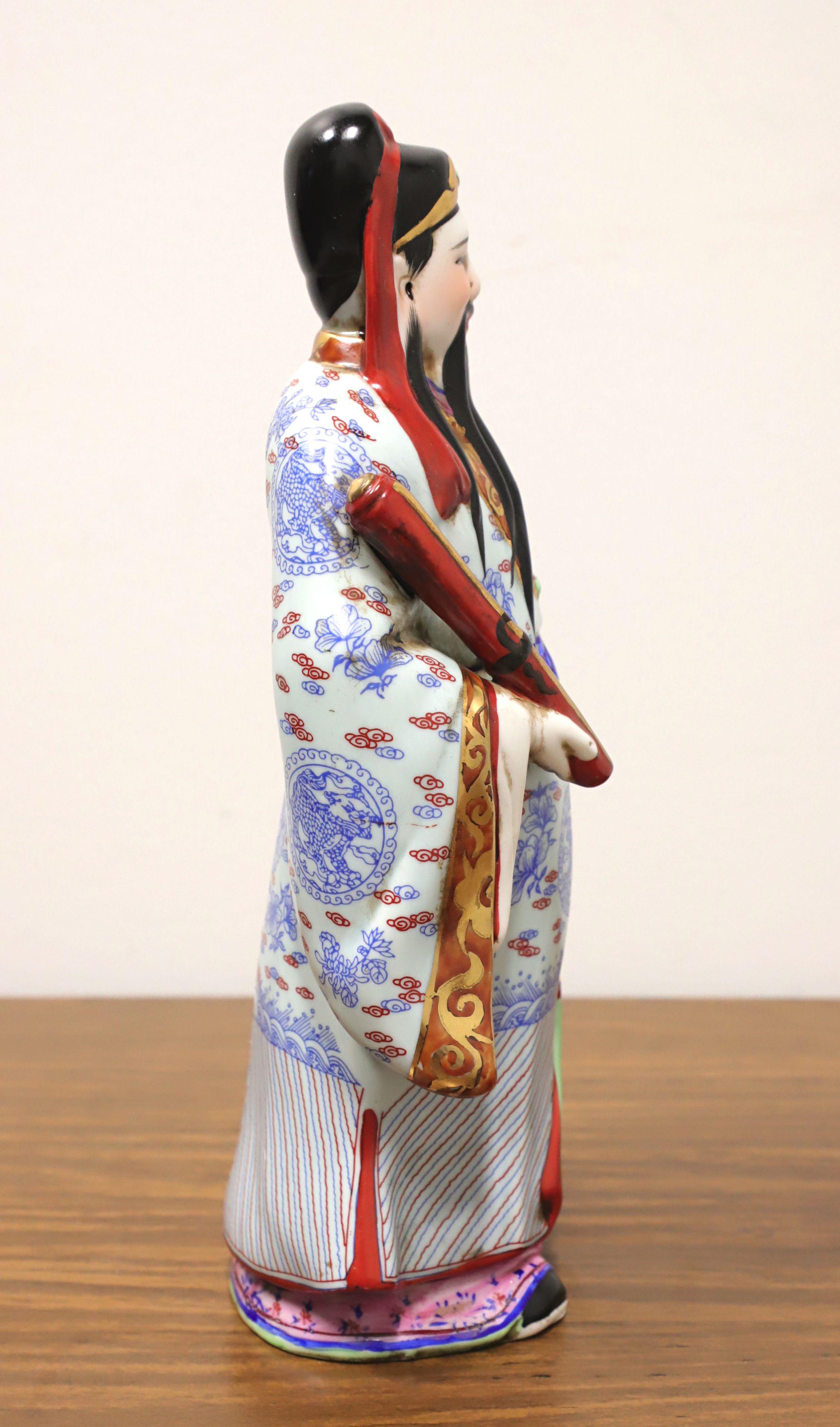 A porcelain figurine depicting one of the Chinese Immortals, 