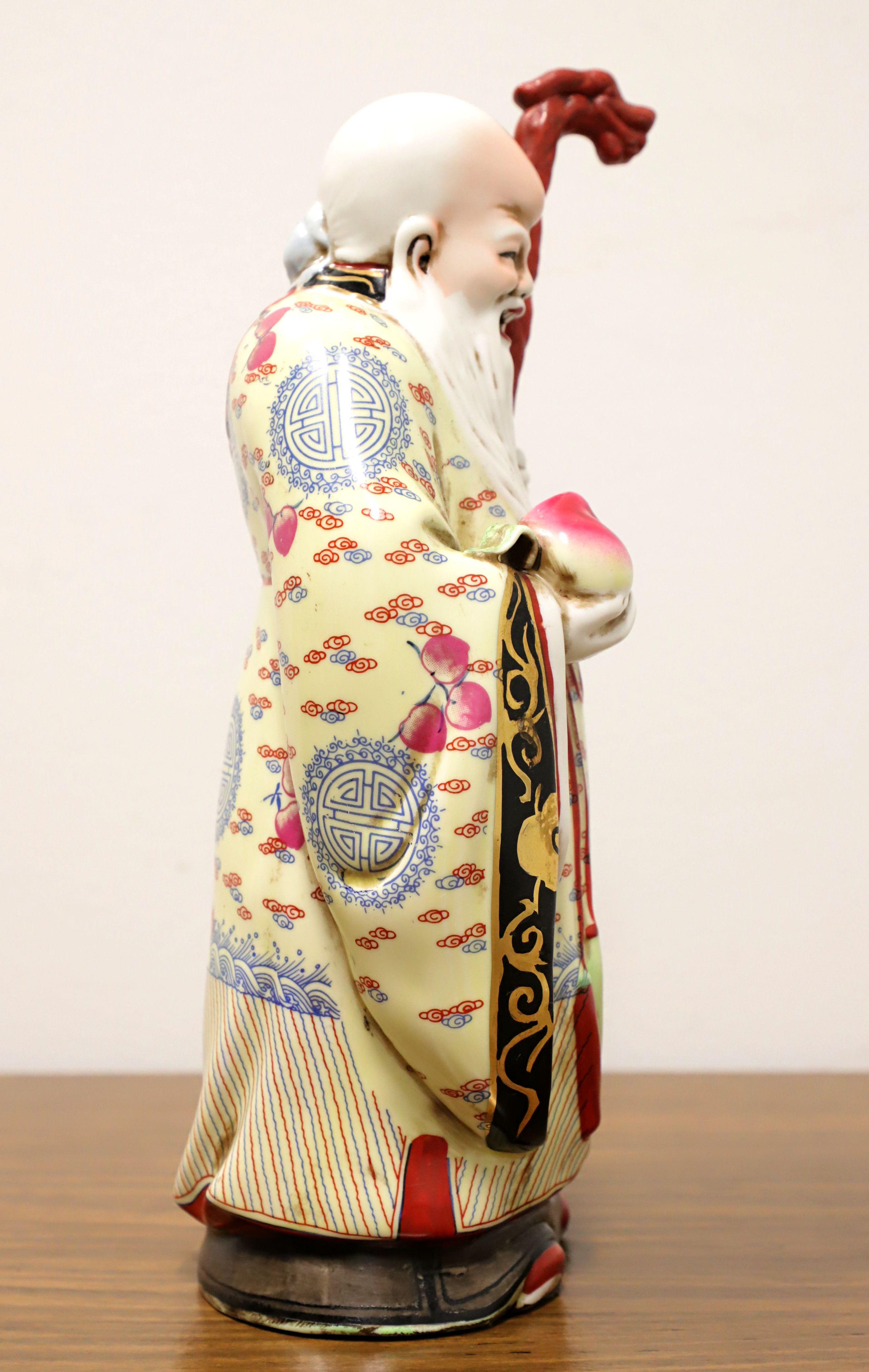 A porcelain figurine depicting one of the Chinese Immortals, 