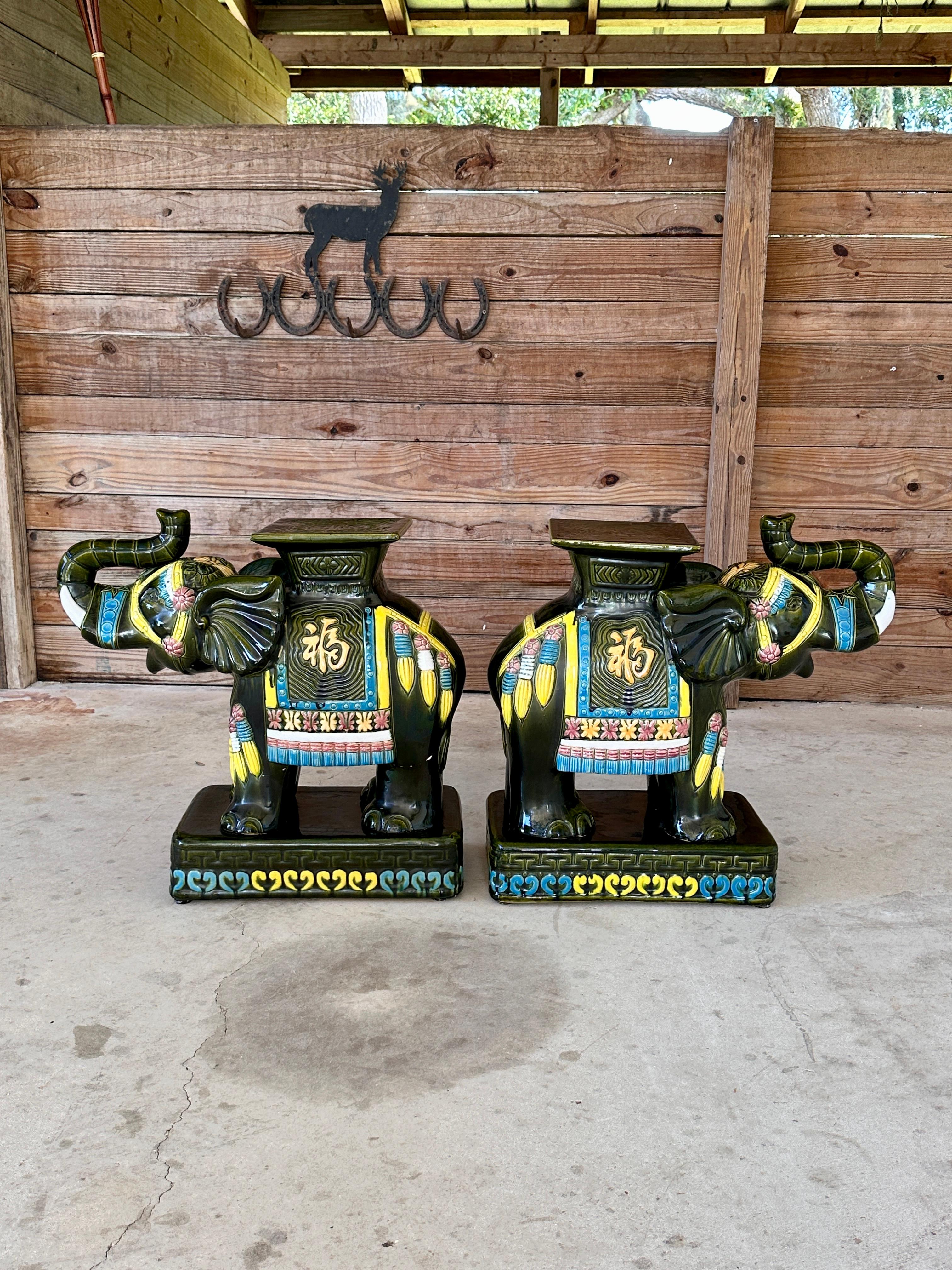 Pair of Late 20th Century elephant garden stools or side tables, featuring vibrant hand-painted details in striking colors.
These whimsical and functional pieces are perfect for indoor or outdoor use, adding a touch of exotic flair to any setting.