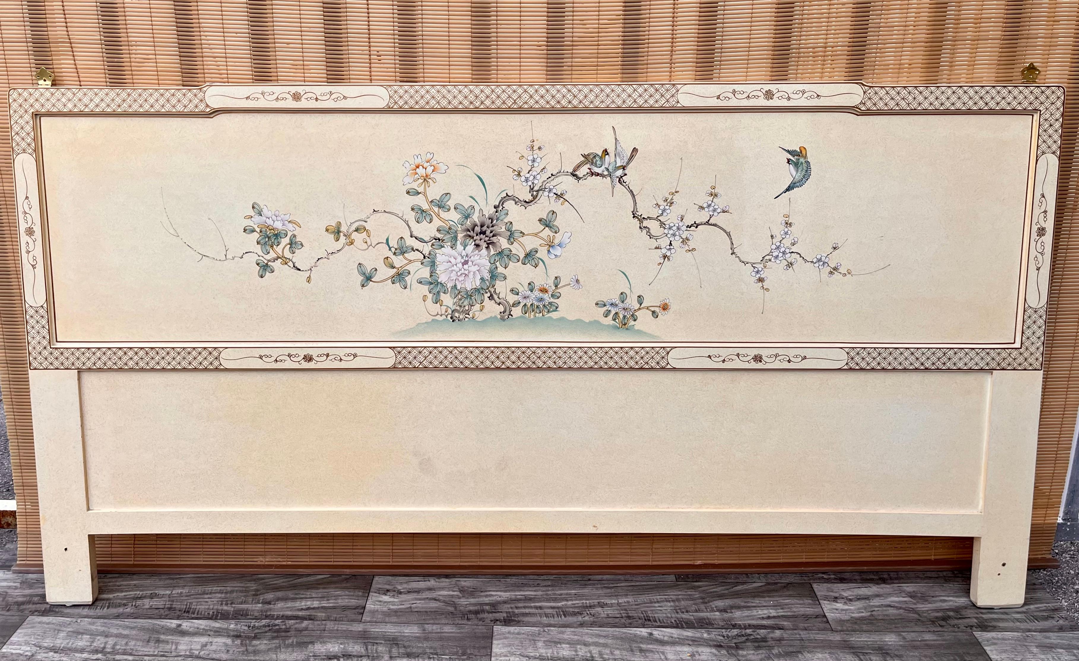 Late 20th century Chinoiserie Lacquer king size headboard. Circa 1990s.
Features an ornate light yellow lacquer finish with an intricate chinoiserie decoration at the front and the back. 
It comes with two brass pleated bracket to attached it to