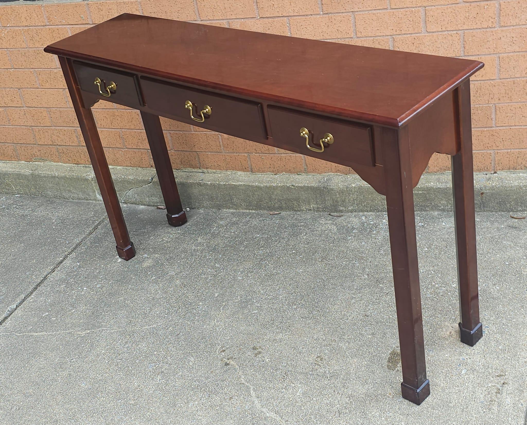 A Late 20th Century Chippendale Style Mahogany Three-Drawer Console Table. Measures 

Measures 48