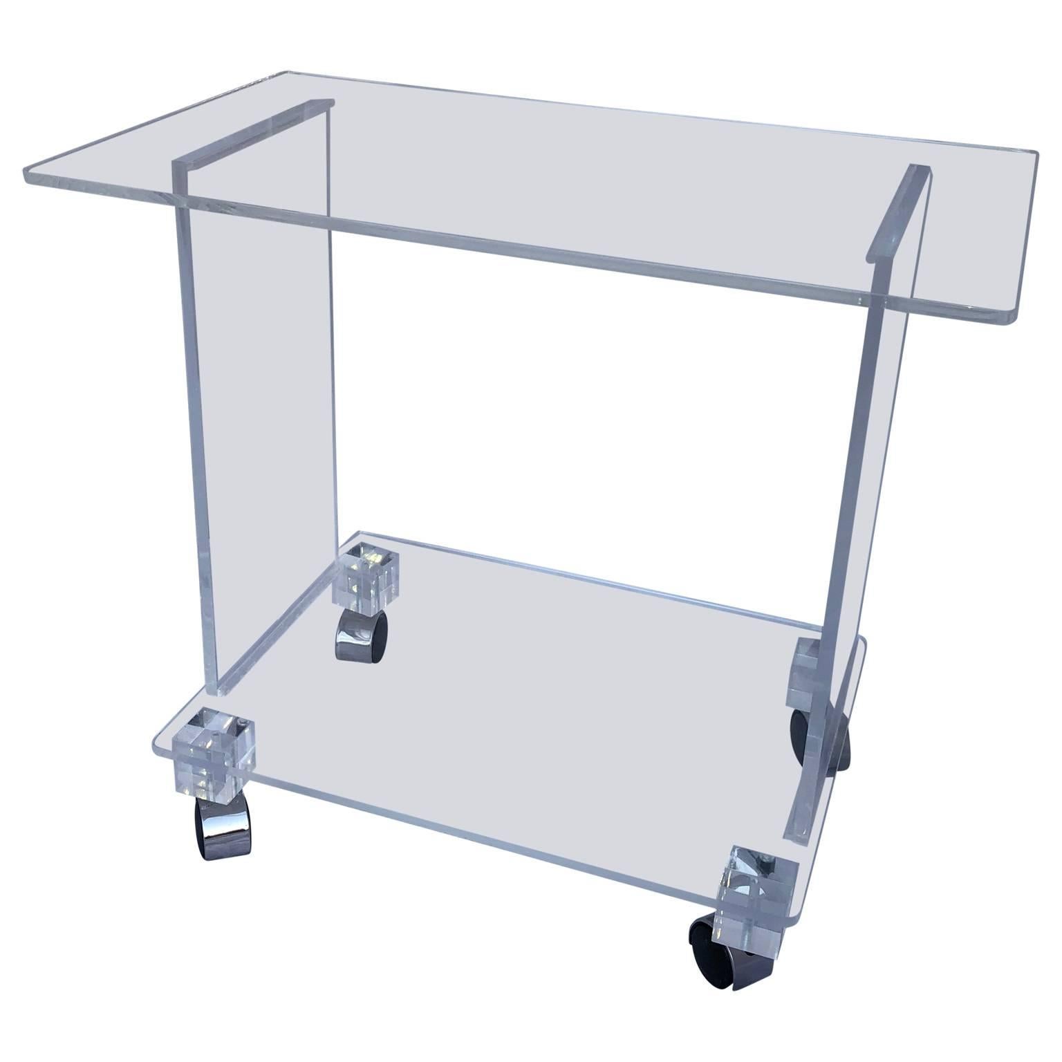 Late 20th Century clear Lucite bar cart on chrome casters

