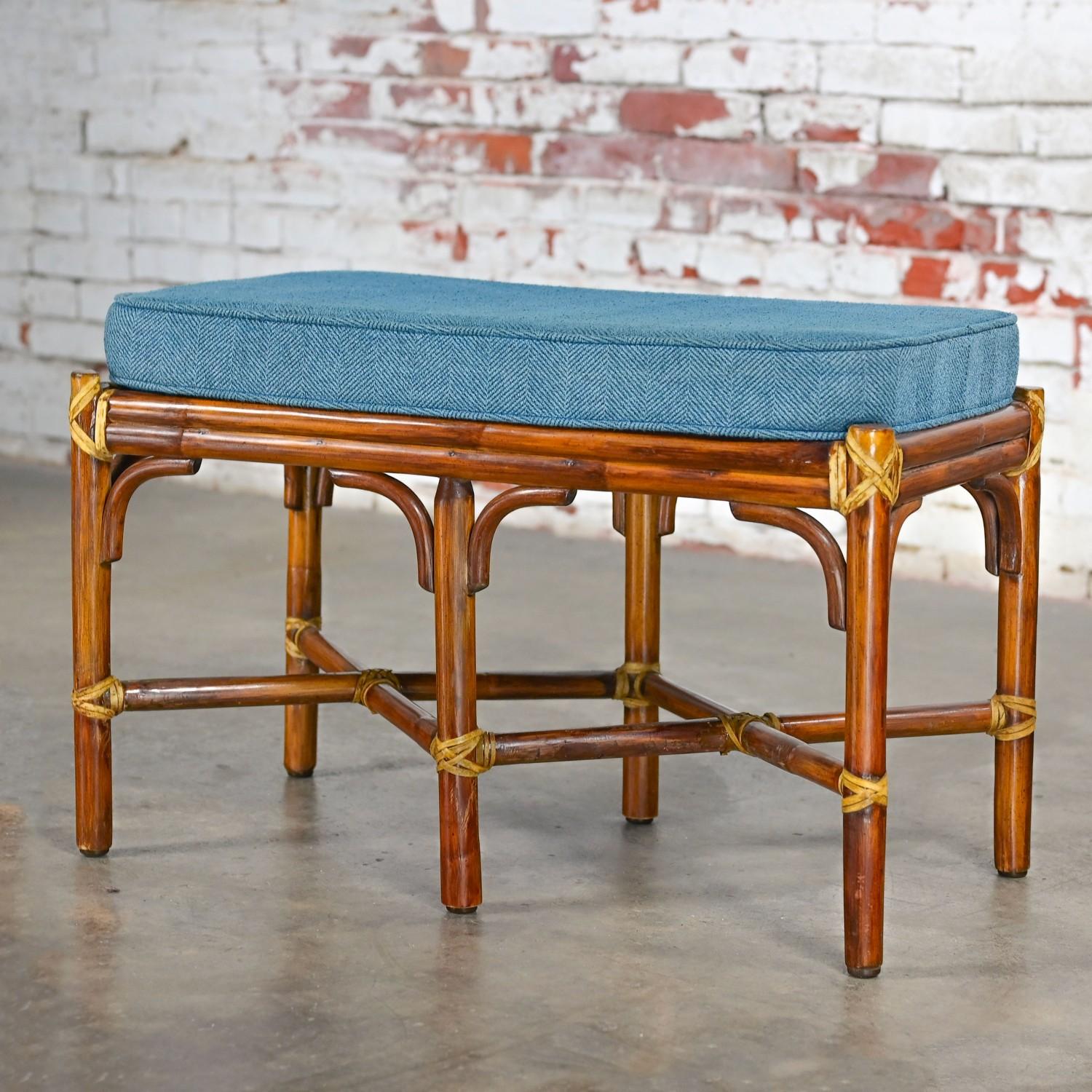 Awesome vintage Coastal Style bench comprised of rattan & rawhide wraps by McGuire with a removeable blue herringbone tweed cushion. Beautiful condition, keeping in mind that this is vintage and not new so will have signs of use and wear even if it