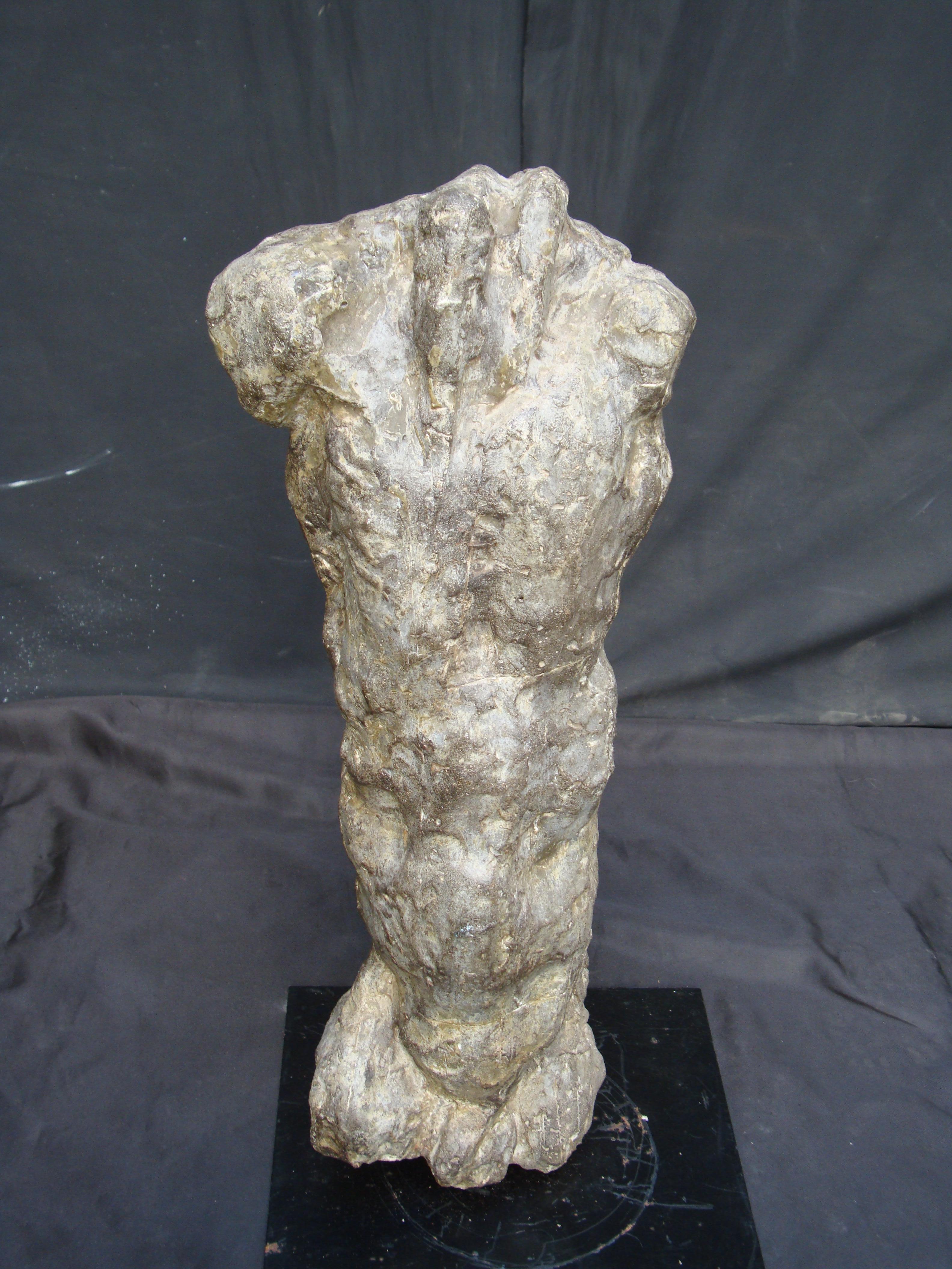 A 20th century composite cements materials male torso on iron base, great plastic effect.