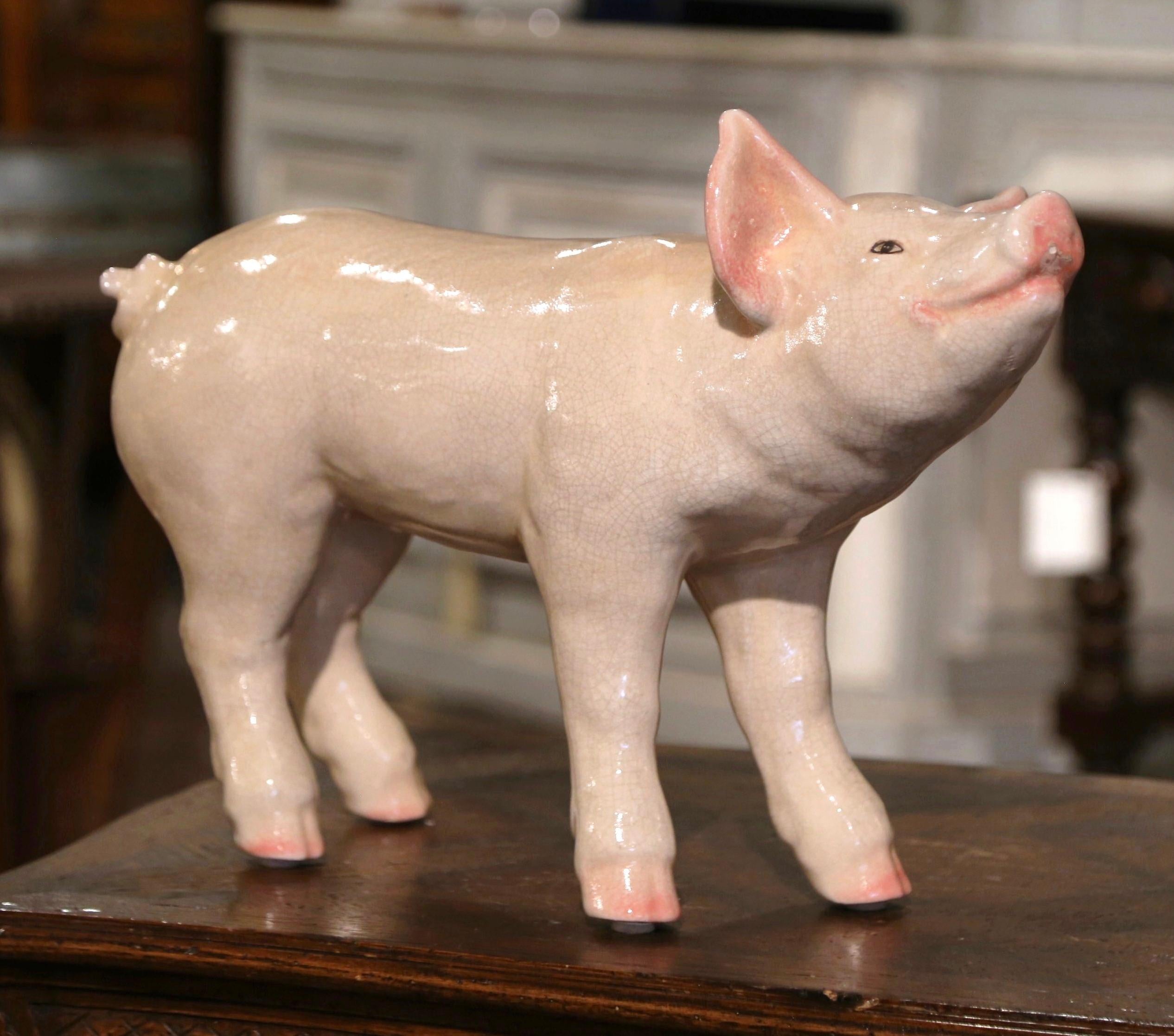 Decorate your kitchen counter with this cheerful sculptured pig. Crafted, circa 1980, the large pig is colorful, expressive, detailed, and realistic in shape and texture. The picturesque ceramic farm animal is in excellent condition and adorns rich