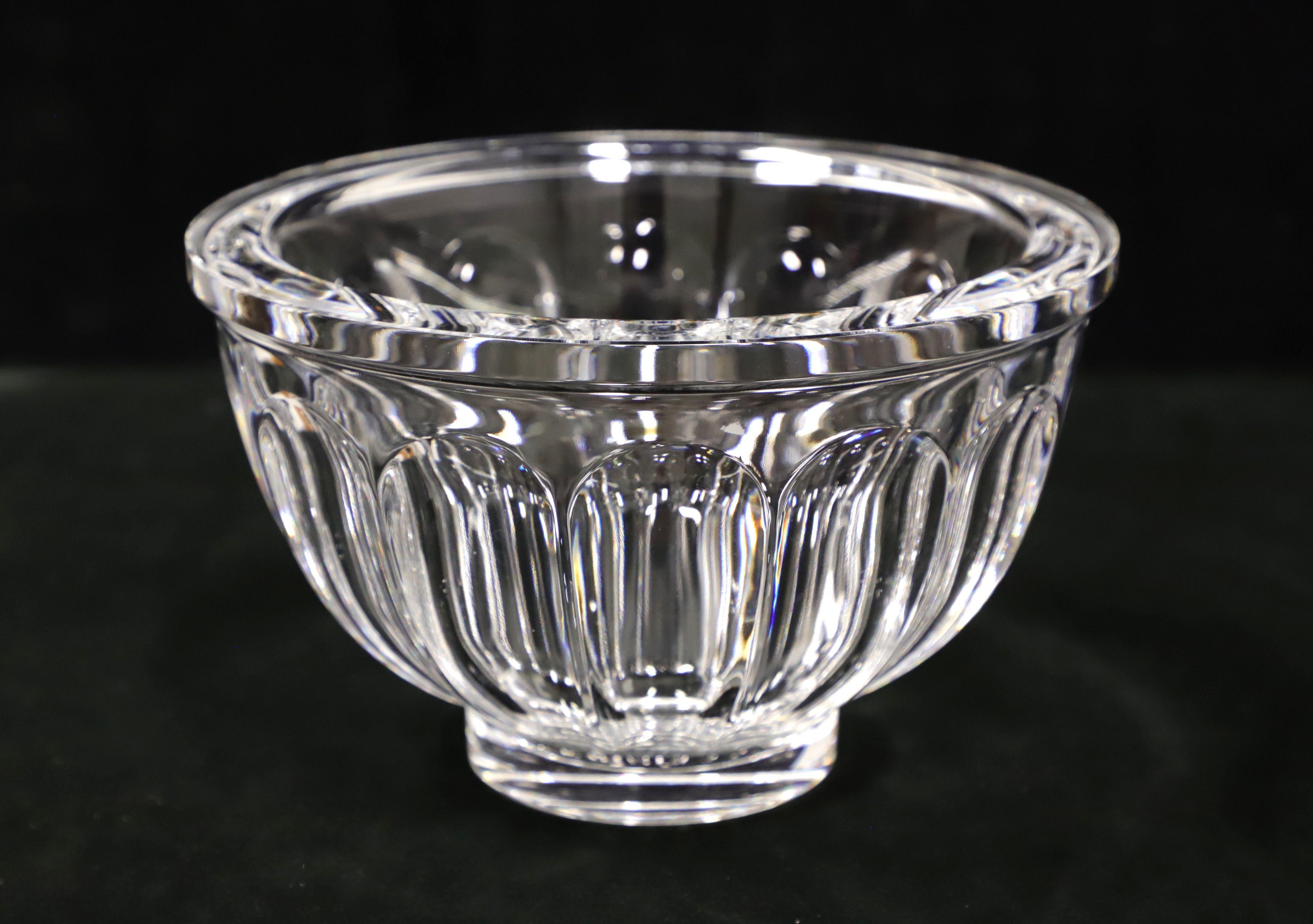 A Late 20th Century decorative crystal bowl. Clear thick crystal round bowl with a narrow solid rim with cut ovals beneath tapering narrower to a solid bottom. Origin unknown, most likely the USA.

Measures: 8W 8D 5H, weighs approximately: 6