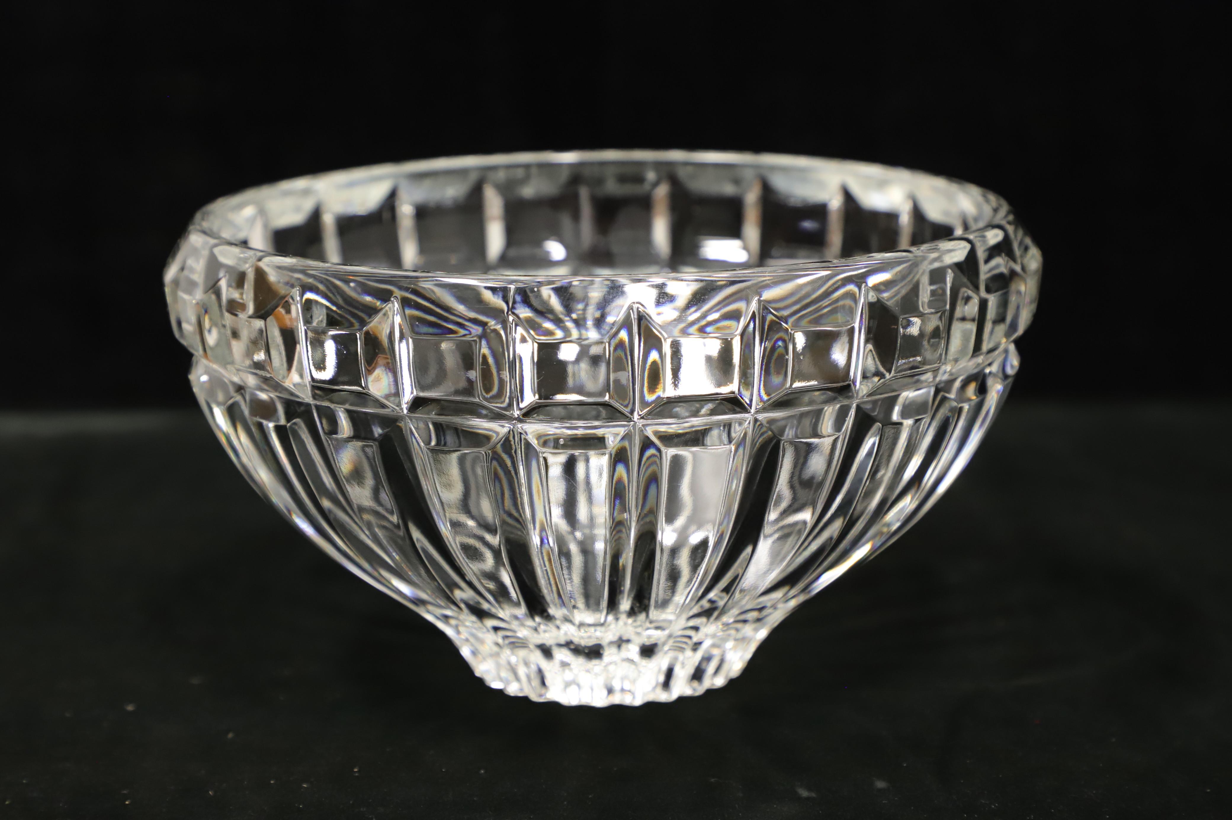 A Late 20th Century decorative crystal bowl. Clear crystal round bowl with a square cut diamond pattern at rim with square cut beneath tapering narrower to bottom. Origin unknown, most likely the USA.

Measures: 8w 8d 4.5h, Weighs Approximately: 3