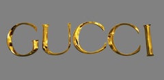 Late 20th Century Decorative Wall Ornament Gucci Letters Made in Golden Brass