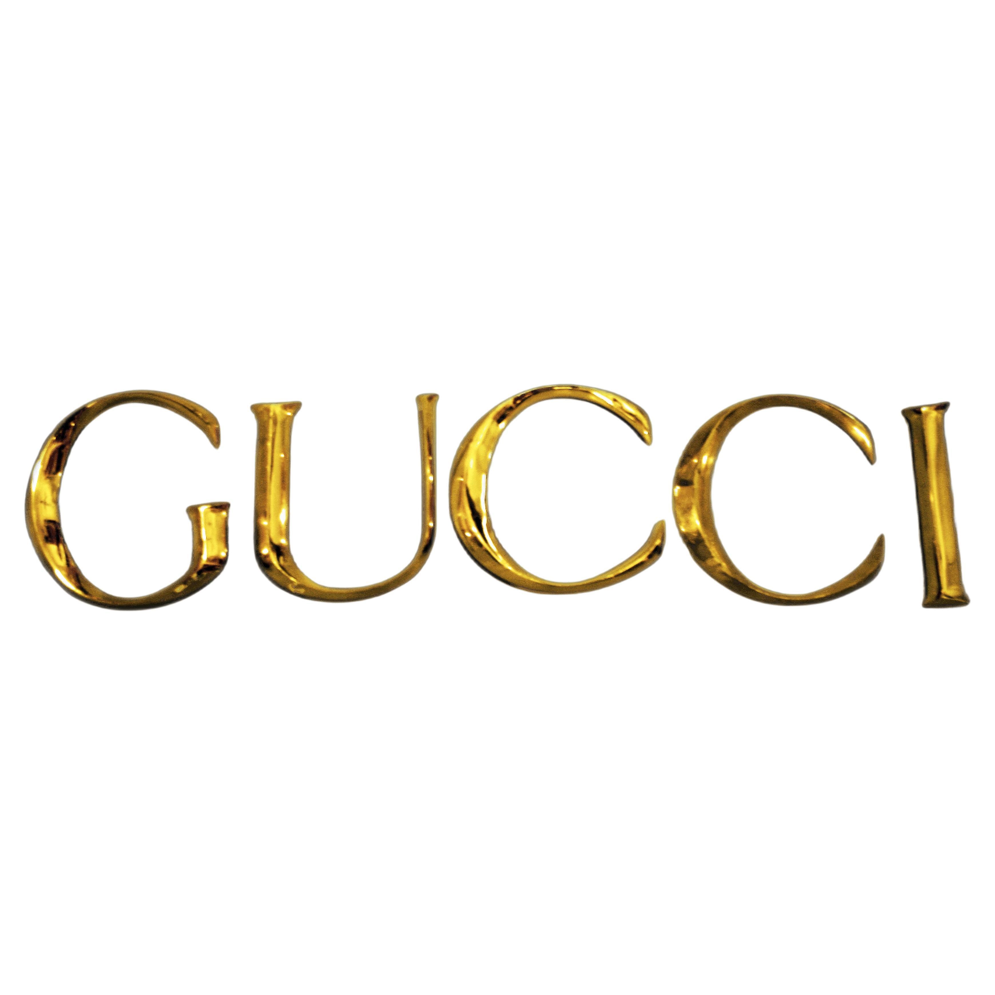 Late 20th Century Decorative Wall Ornament Gucci Letters Made in Golden Brass For Sale