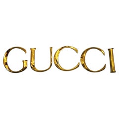 Dekorative Wandschmuck des späten 20. Jahrhunderts Gucci Buchstaben aus goldenem Messing