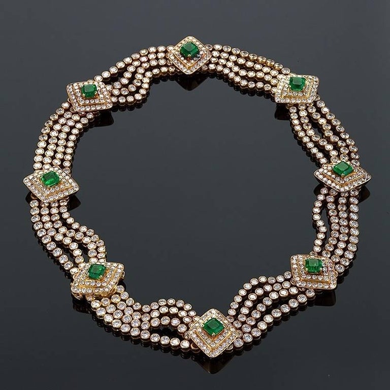 A Late-20th Century Italian 18 karat gold, diamond and emerald necklace. The necklace has 592 circular-cut diamonds with an approximate total weight of 35.00 carats, F/G color, VS clarity, and 8 rhomboid-shaped emeralds with an approximate total