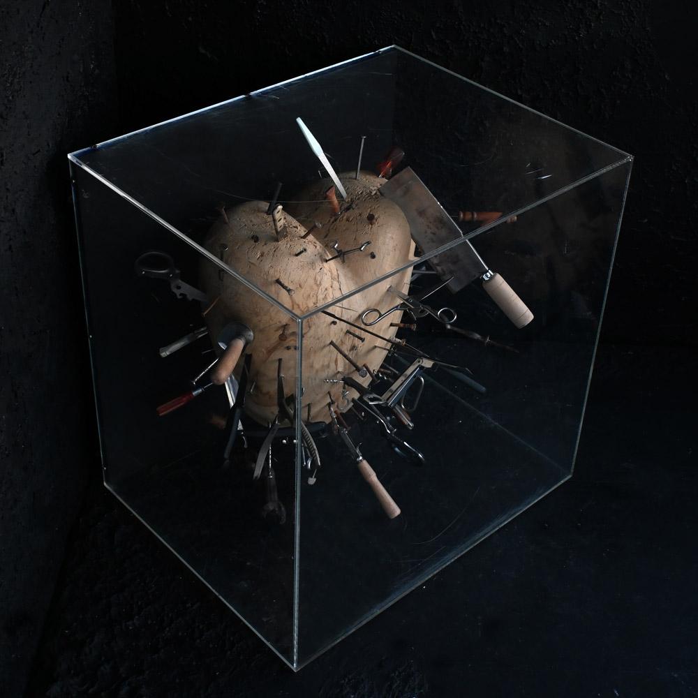 Late 20th Century encased art installation entitled “Heart Ache” 
Dimensions in inches: H 24” x W 24” x D 19” 
Age: Late 20th Century 
Origin: Unknown
Condition: Good
Overview
An unusual piece of modern-day art, entitled “Heart ache”. In the form of