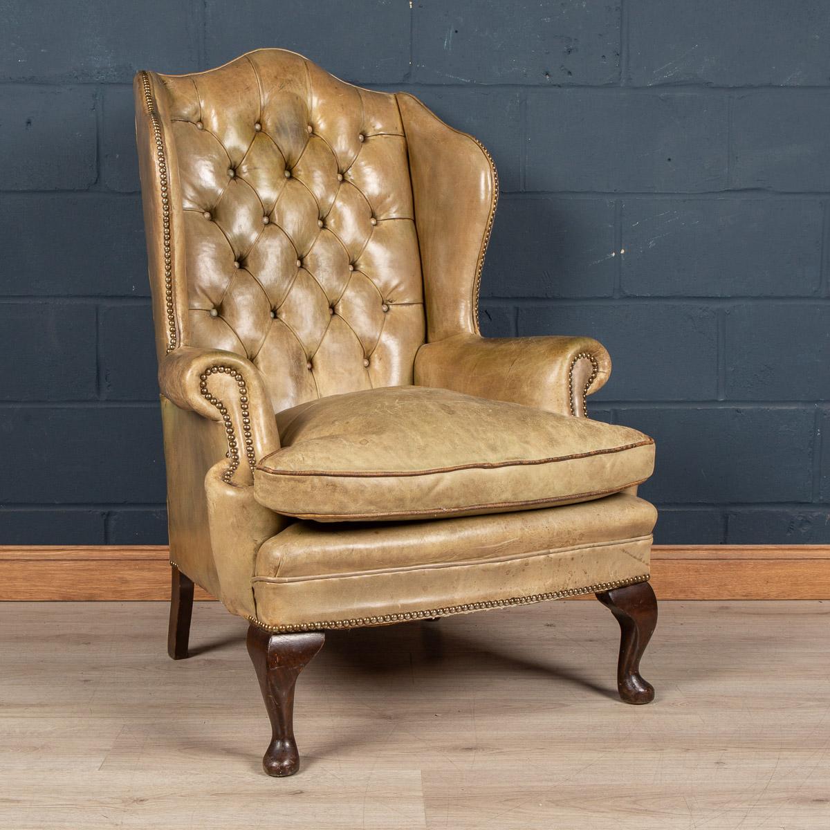 A lovely English wing back leather chair with button down backrest from the middle of the last century, the hand dyed leather giving it a great patina and colour.

Condition
In good condition - wear and tear consistent with age. Some crazing to