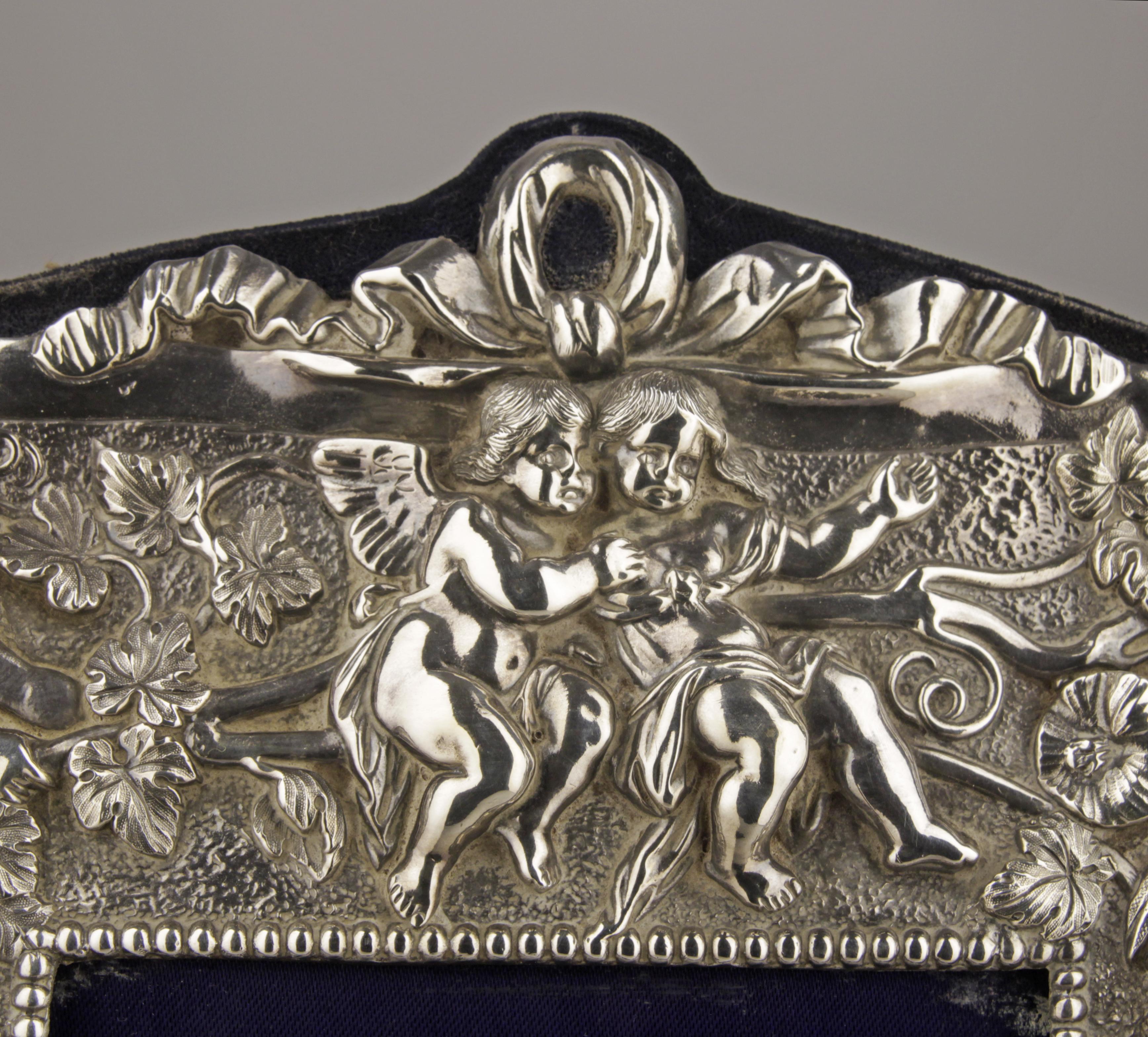 Repoussé Late 20th Century English Sterling Silver Frame with Cherubs and Plant Motifs