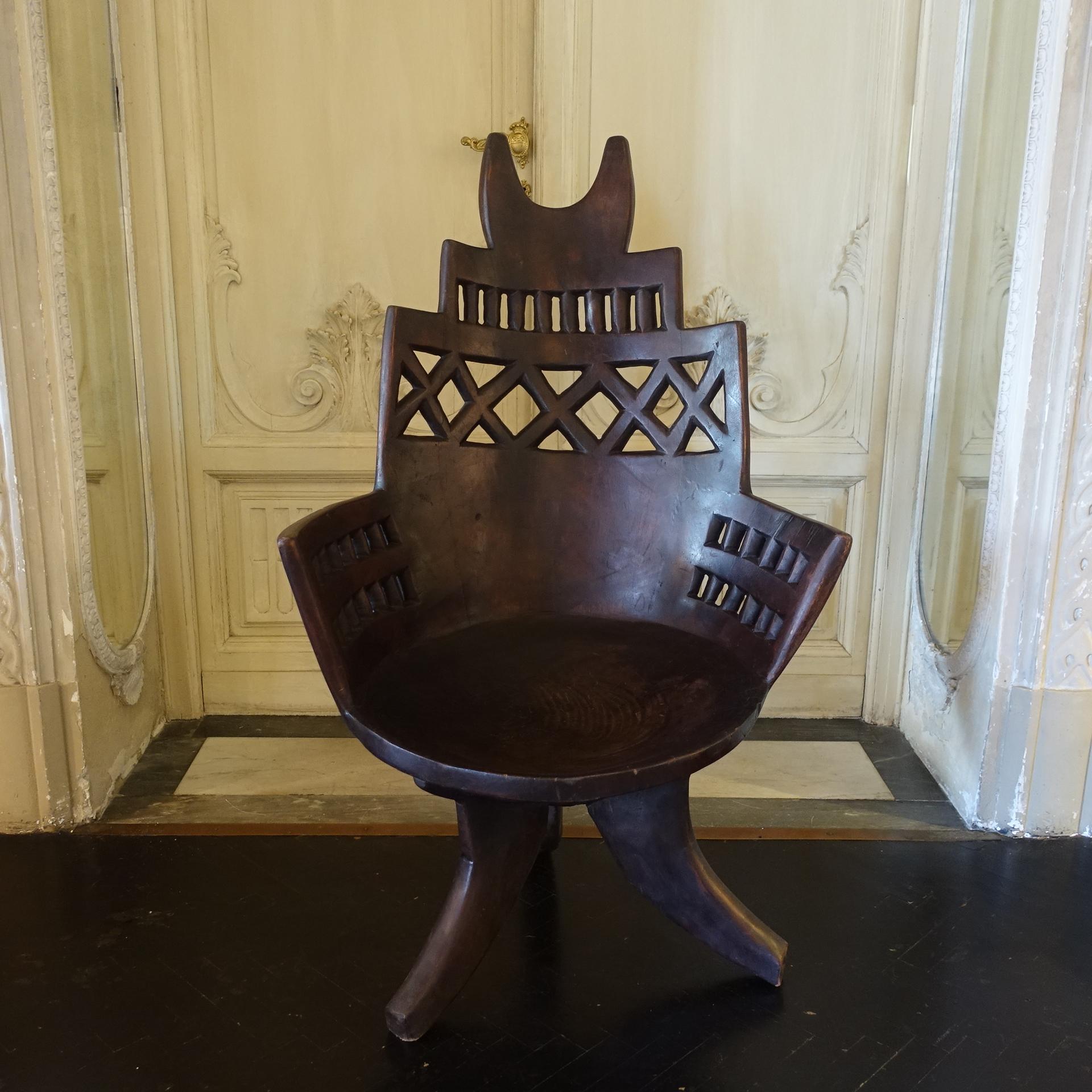 Early 20th Century one of a kind chair from the Jimma region, Ethiopia, carved from a single trunk of wood, the Jimma people did not use glue, nails or joinery in making these unique pieces, vintage patina.