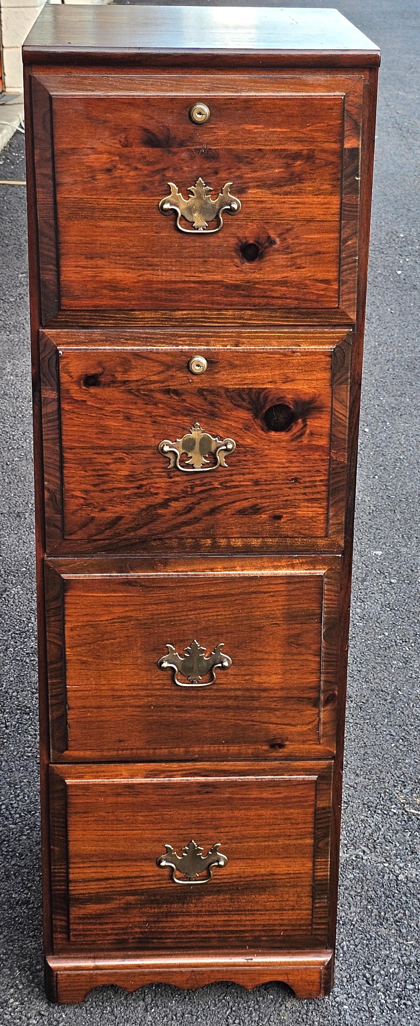 A Late 20th Century Four-Drawer Solid Pine Filing Cabinet with Locks and Keys in the old tavern style, with built-in file folders handing rails and two top locking drawers with keys.
Measures 15.25