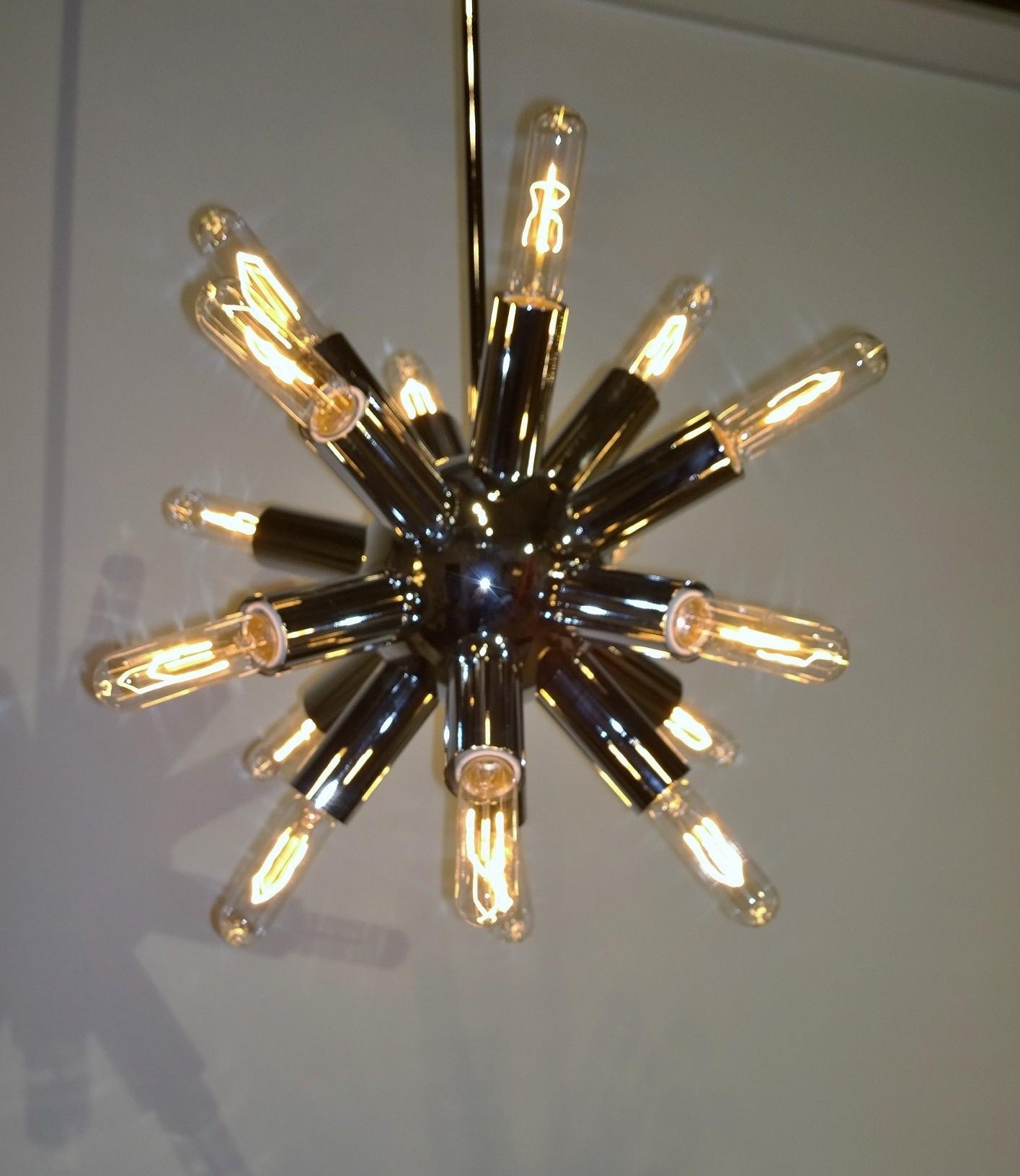 Offered is a late 20th century fourteen-arm / socket Lightolier chrome Sputnik with long tubular modern bulbs chandelier. This chandelier is in such pristine condition, we are not sure if the chandelier was ever used. Quite thick and compact, this