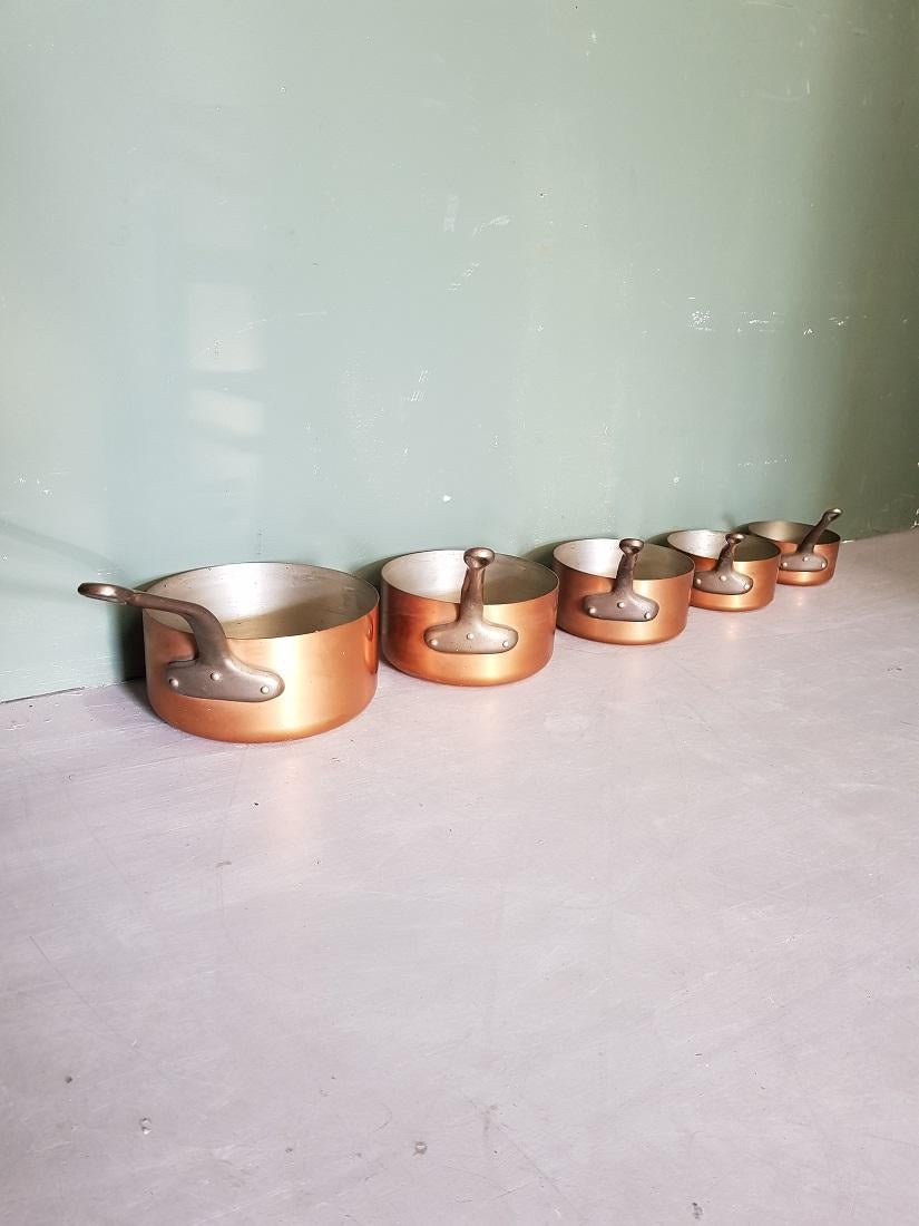 5-piece French copper pan set with metal handles and tinned interior and all 5 marked and made by Les Cuivres Faucogney, they are in good but used condition, late 20th century.

The measurements are,
Diameters 12, 14, 16, 18 and 20 cm/ 4.7, 5.5,