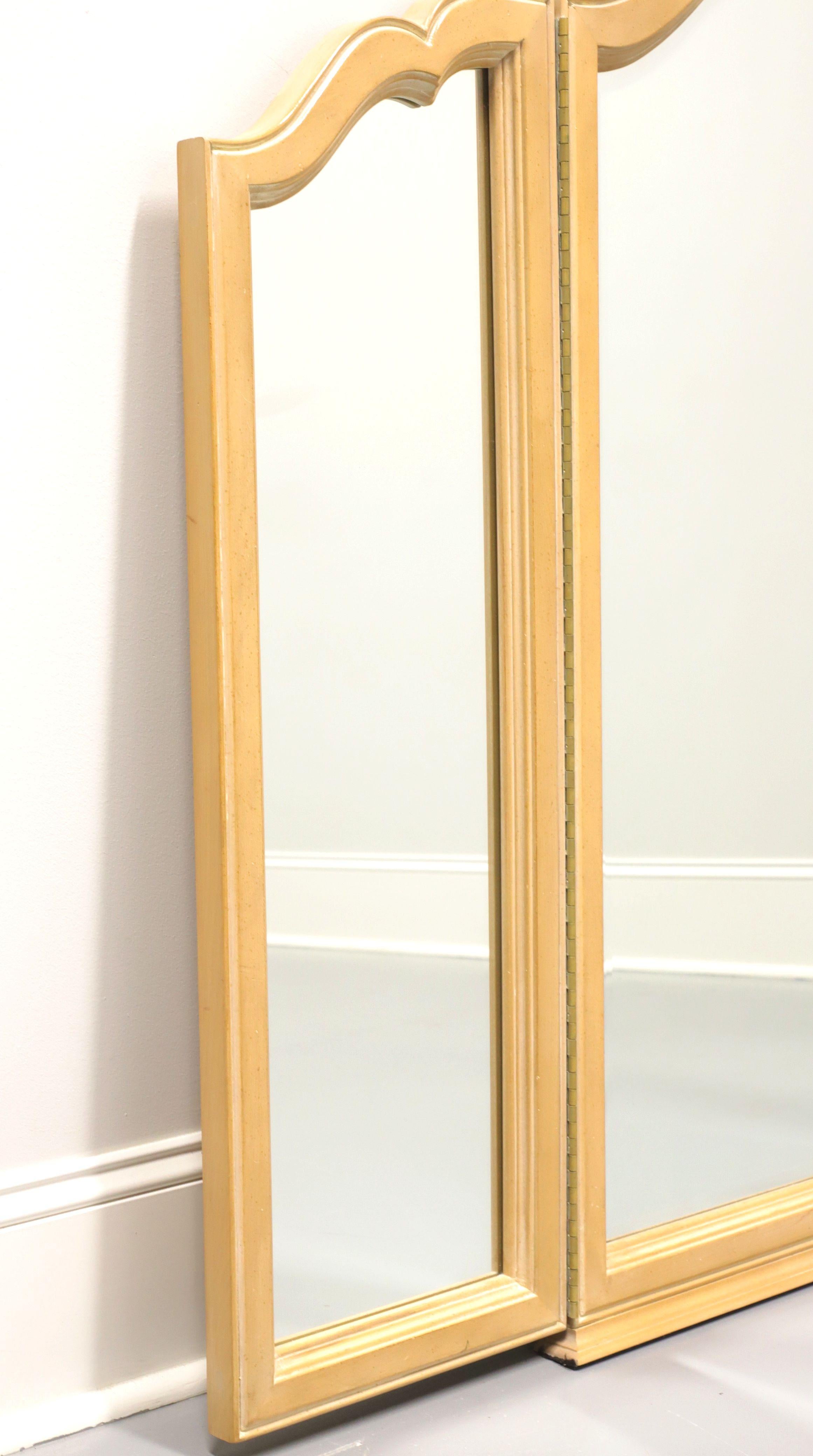 A tri-fold dresser mirror in the French Country style, unbranded, similar quality to Thomasville. Solid hardwood frame with distressed whitewashed finish and a carved shell to the top. Features bevel edge mirrored glass in the center and two side