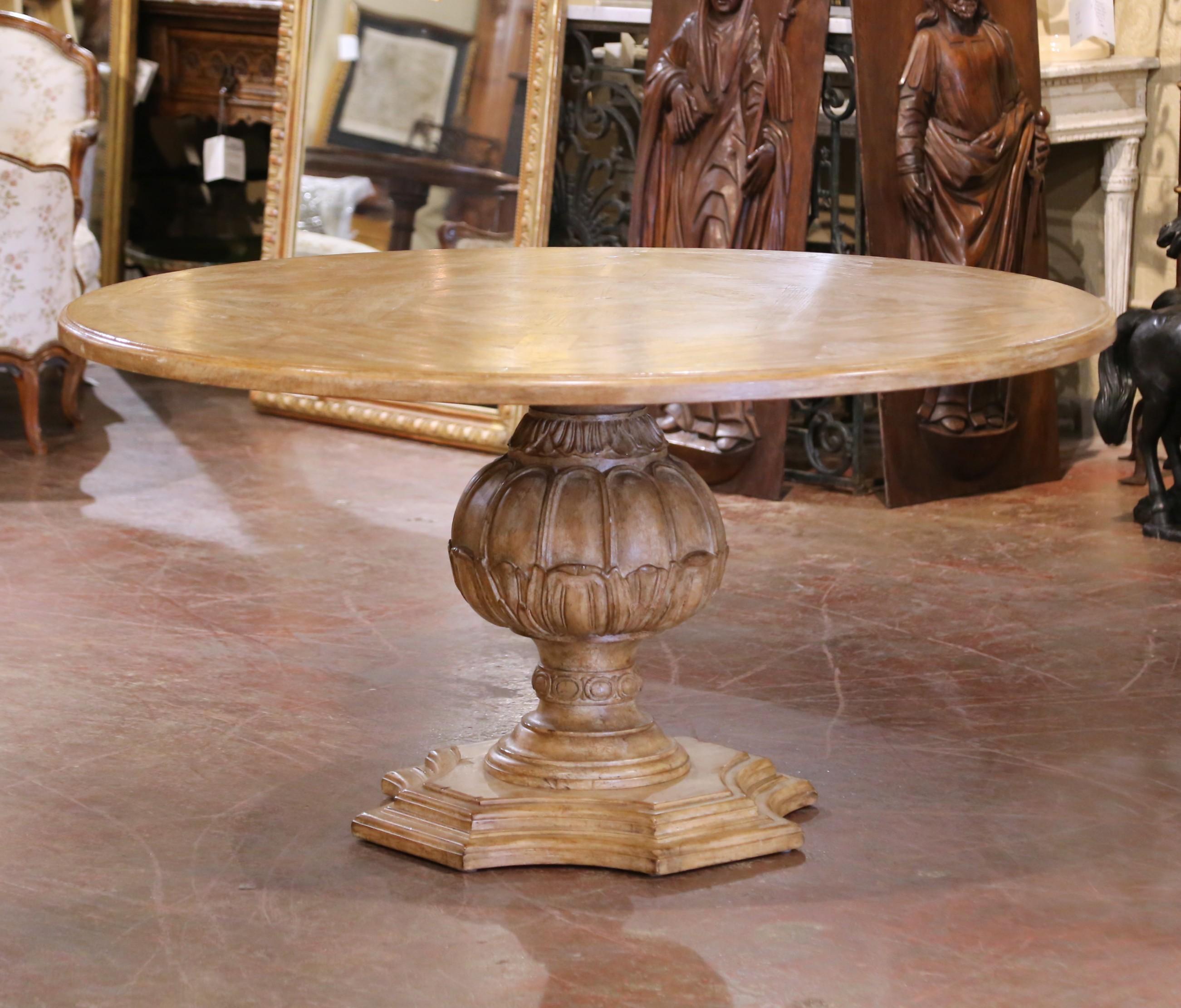 Decorate a breakfast room with this refined French dining suite. Crafted circa 1980 and built from solid oak, the set includes a round Louis XV-style table and six matching upholstered chairs. The 59.25-inch diameter tabletop showcases a