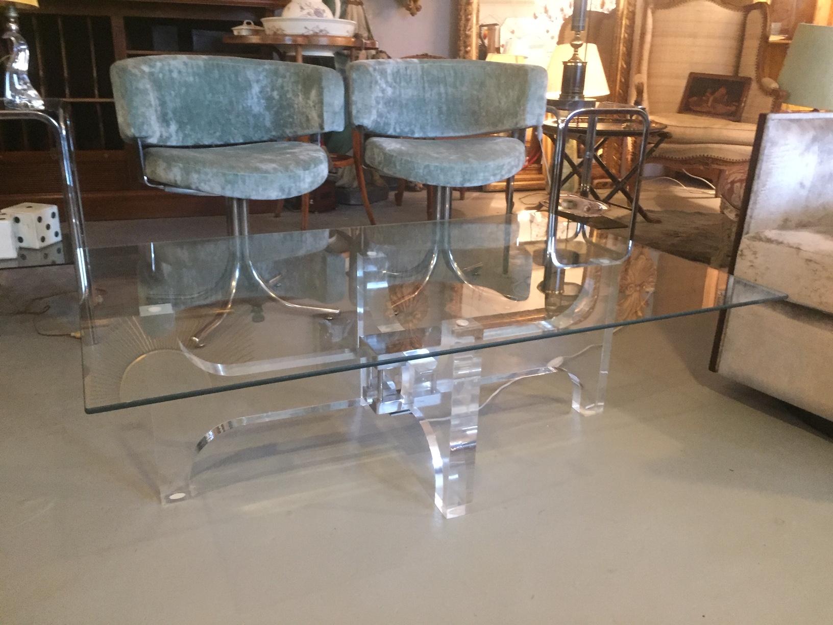 Beautiful and rare 20th century French light coffee table from the 1970s.
The tabletop is made with thick glass and the base is made with plexiglass.
The Plexiglass base can be Lighted by a bulb at the center of the table. The top is