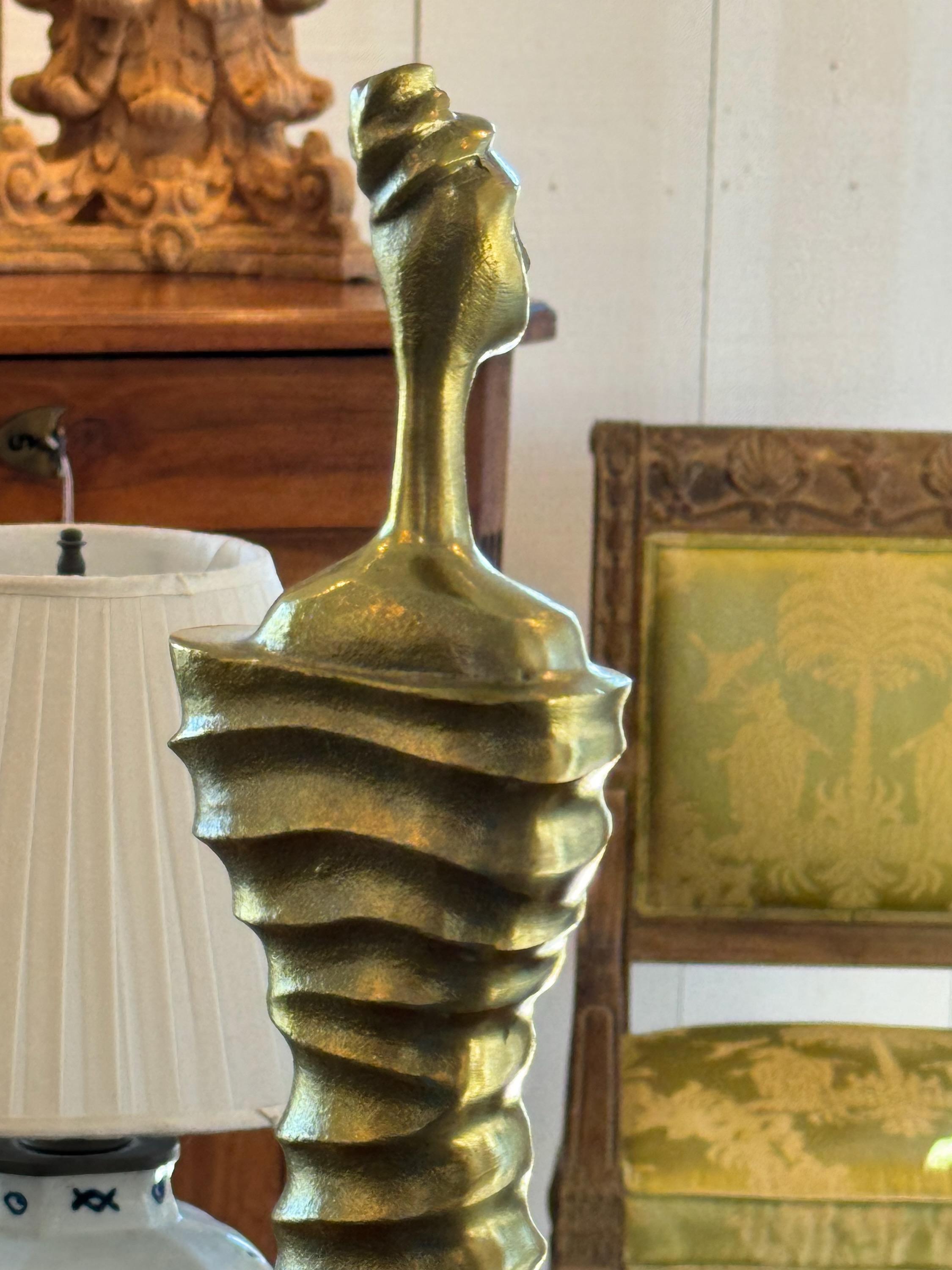 An abstract modern sculpture. Brass and marble.
