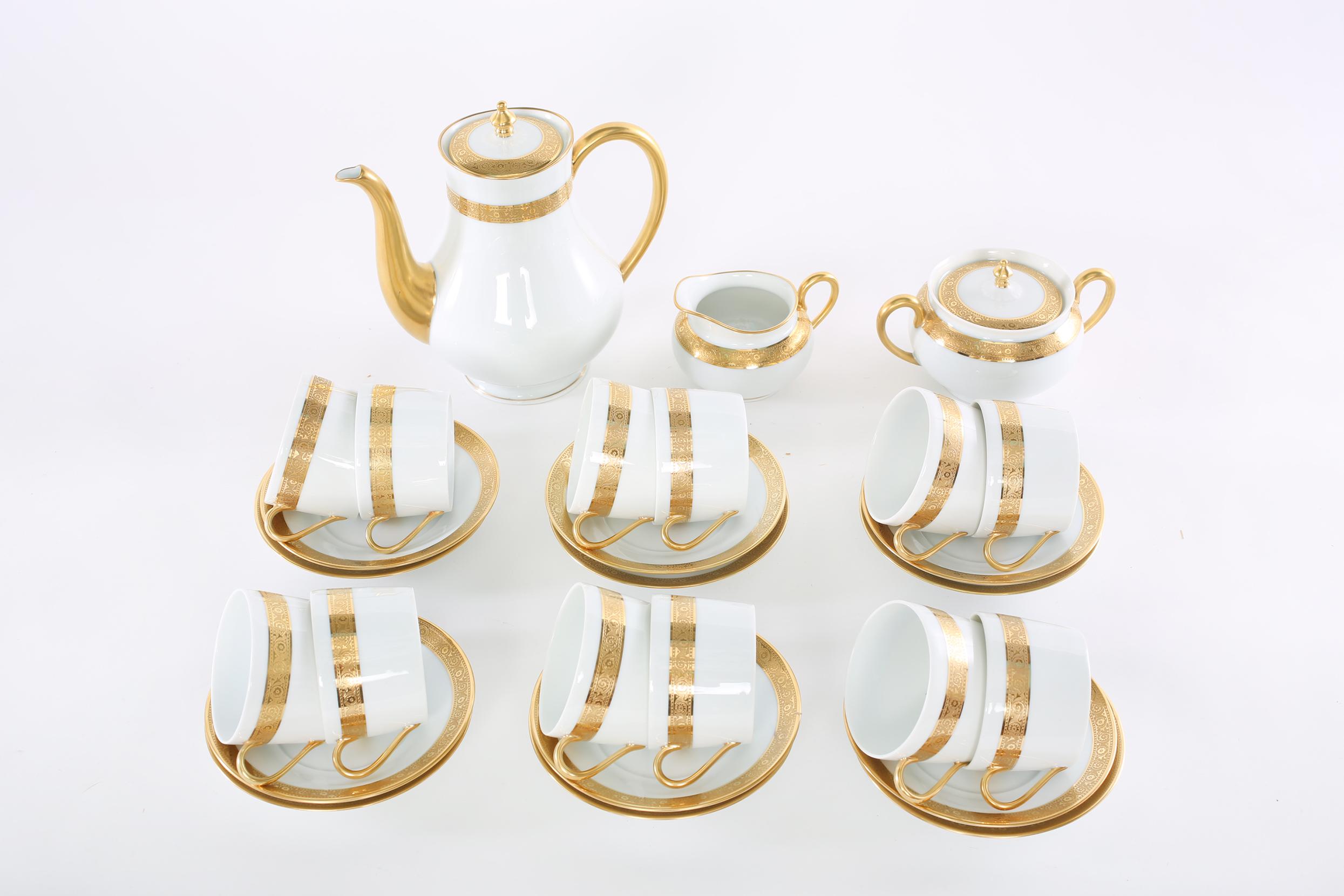 Late 20th century Haviland, Limoges France gilt porcelain tea / coffee service for twelve people. Each piece is great condition. Marks (Tower) Haviland Limoges, France undersigned. Alltogether 27 pieces. Set include 12 tea / coffee cups 4