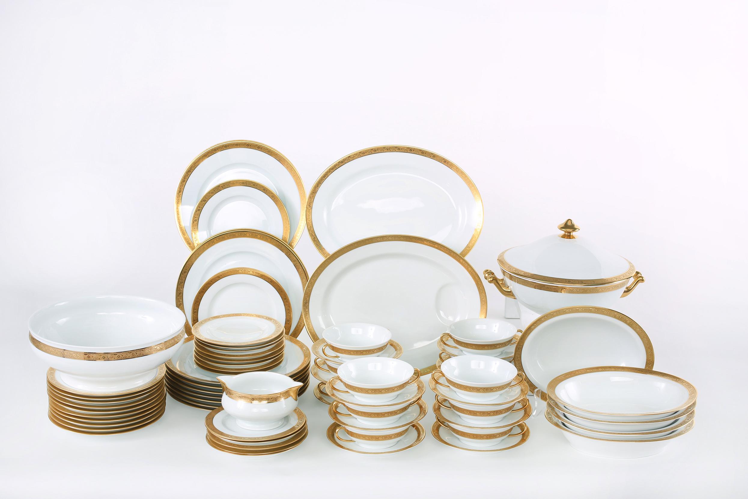 Late 20th century Haviland, Limoges France gilt porcelain complete dinnerware service for twelve people with Serving piece. Each piece is great condition. Marks (Tower) Haviland Limoges, France undersigned. Alltogether 69 pieces. Set include: 12
