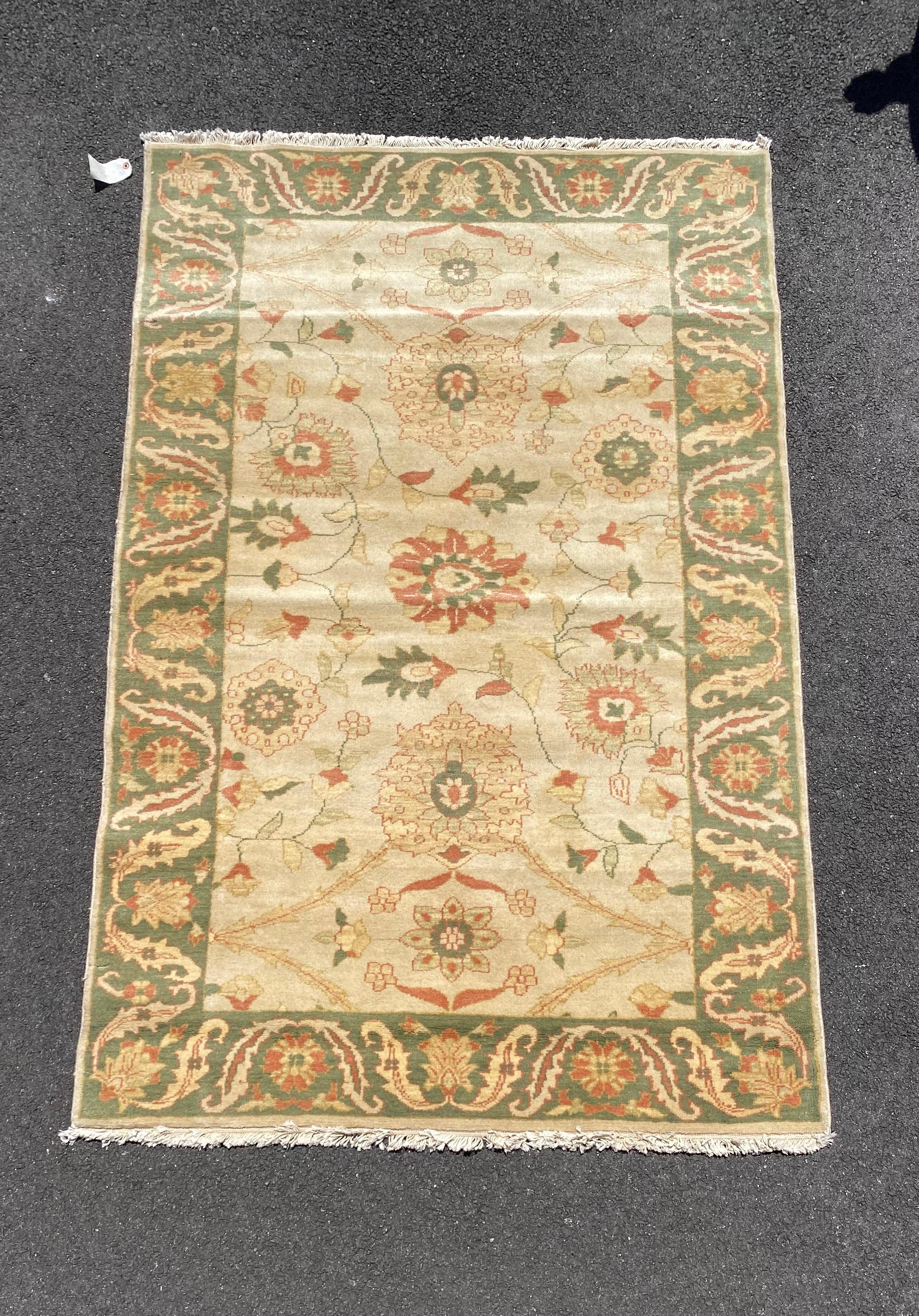 This is a new Egyptian rug in Persian design handwoven in Alexandria, Egypt in the 1990s. We manufactured these rugs and the design and colors were hand chosen by us and we have a wide variety of sizes in this style. This one measures 4 x 6.2 ft