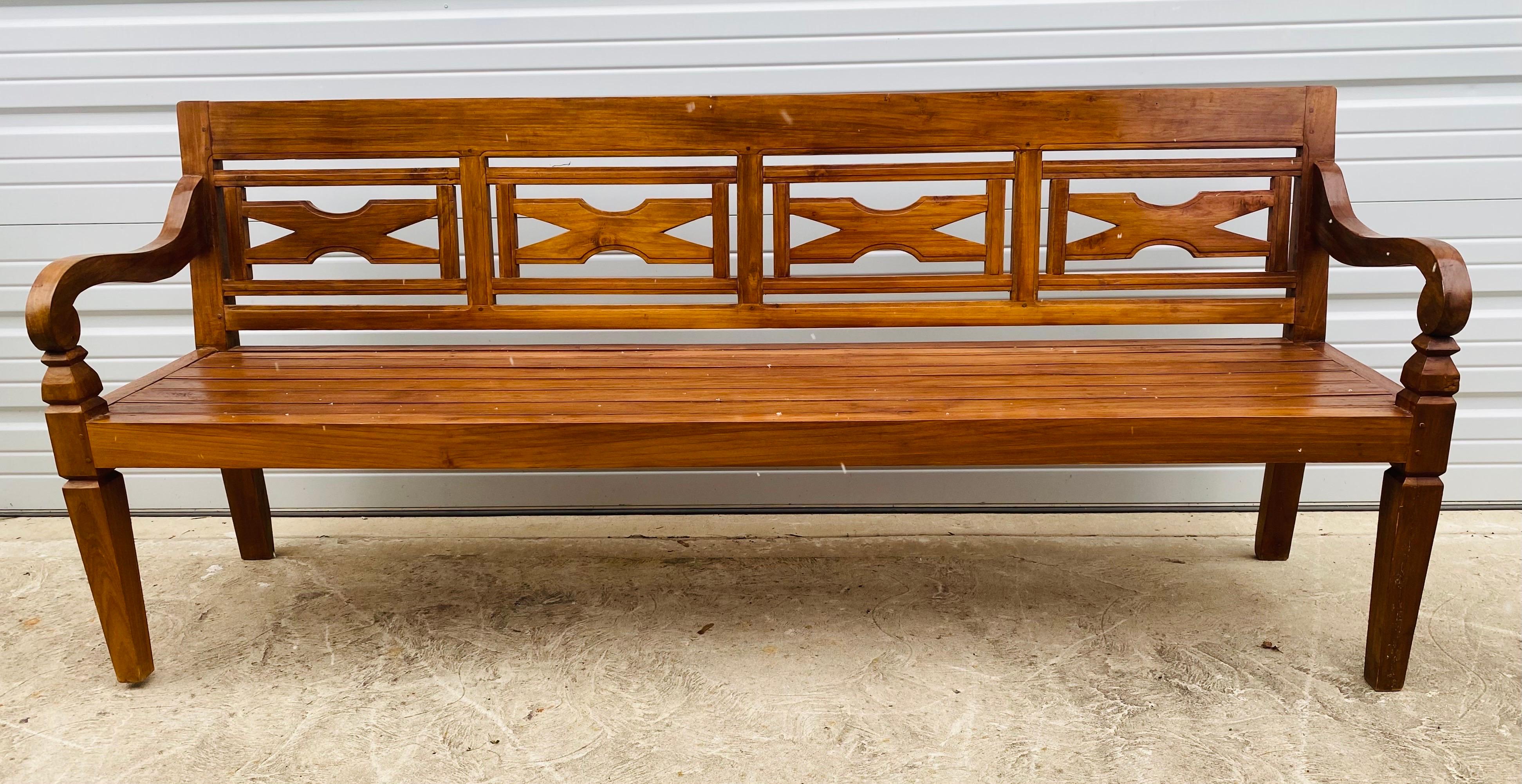Indonesian Late 20th century hand carved teak decorator bench. For Sale