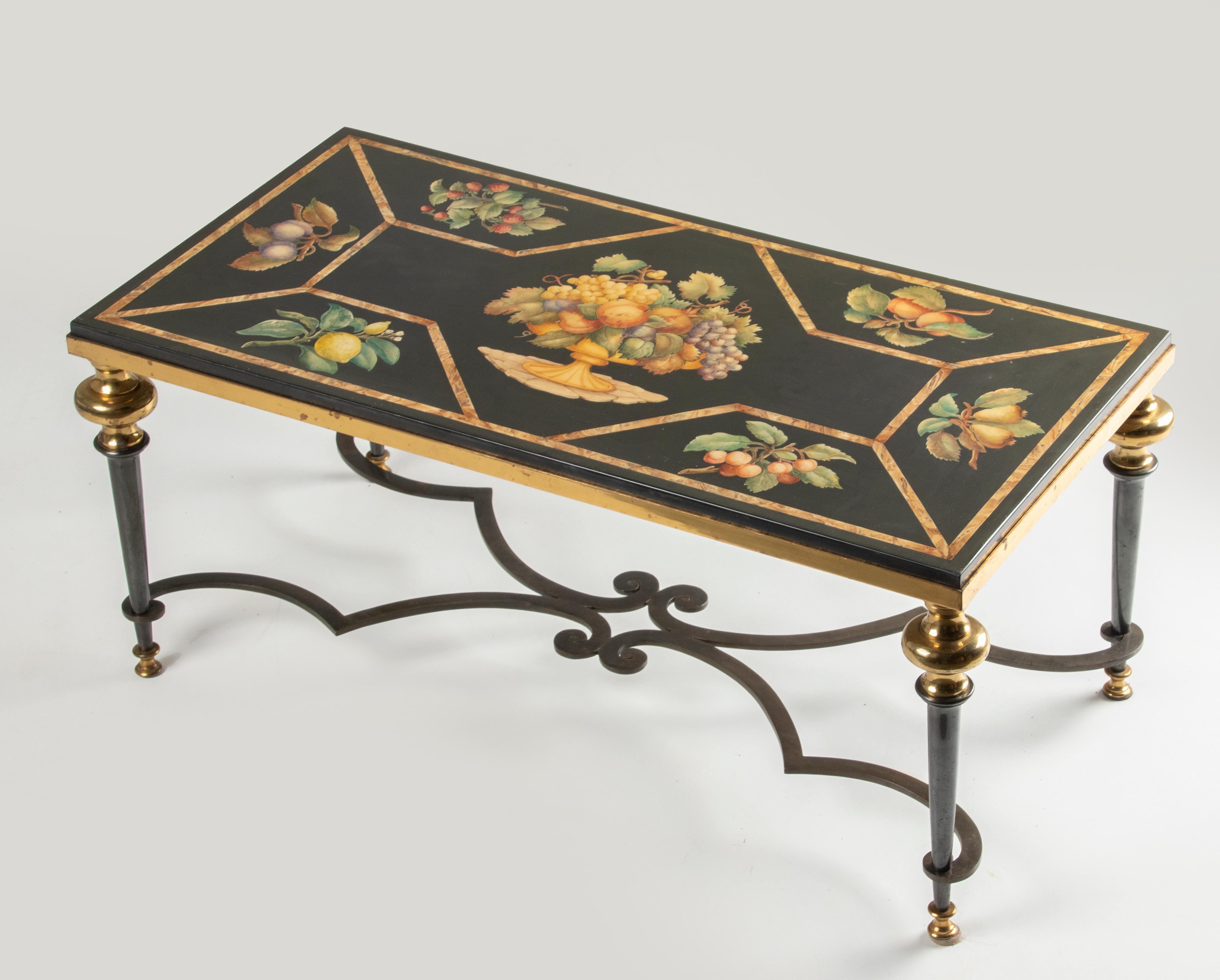 A late 20th century Italian Scagliola coffee table with marble top, resting on a heavy solid iron base, black patinated with brass accents. The marble top depicting several fruits, in the center a fruitbowl. The inlayment is hand crafted with