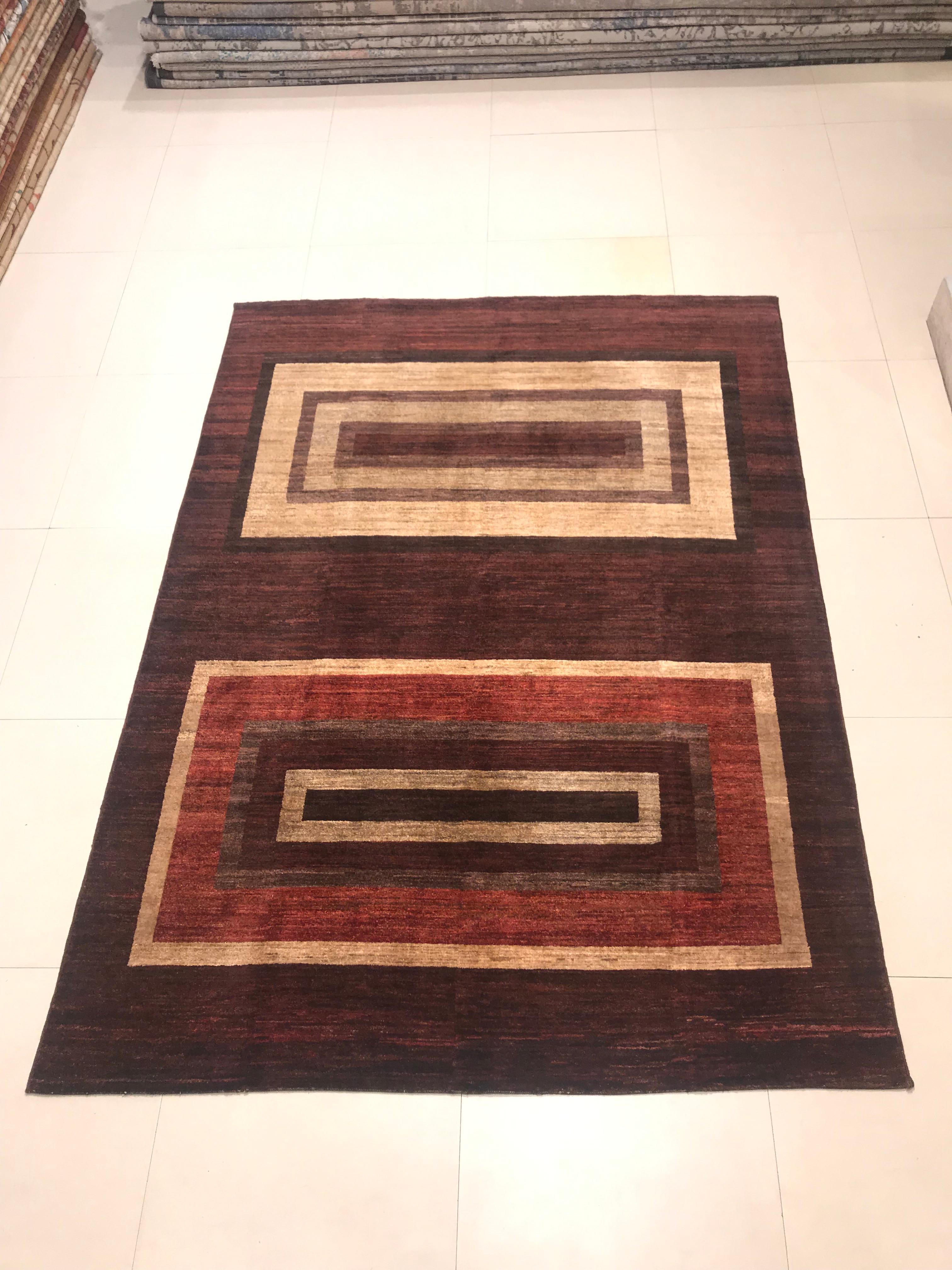 Afghan rug, from the 1970s, hand knotted with wool and cotton.
This set of carpet has geometric drawings, gives off a combination of soft colors such as red, beige and brown that makes it a perfect piece to decorate a corner of our home.