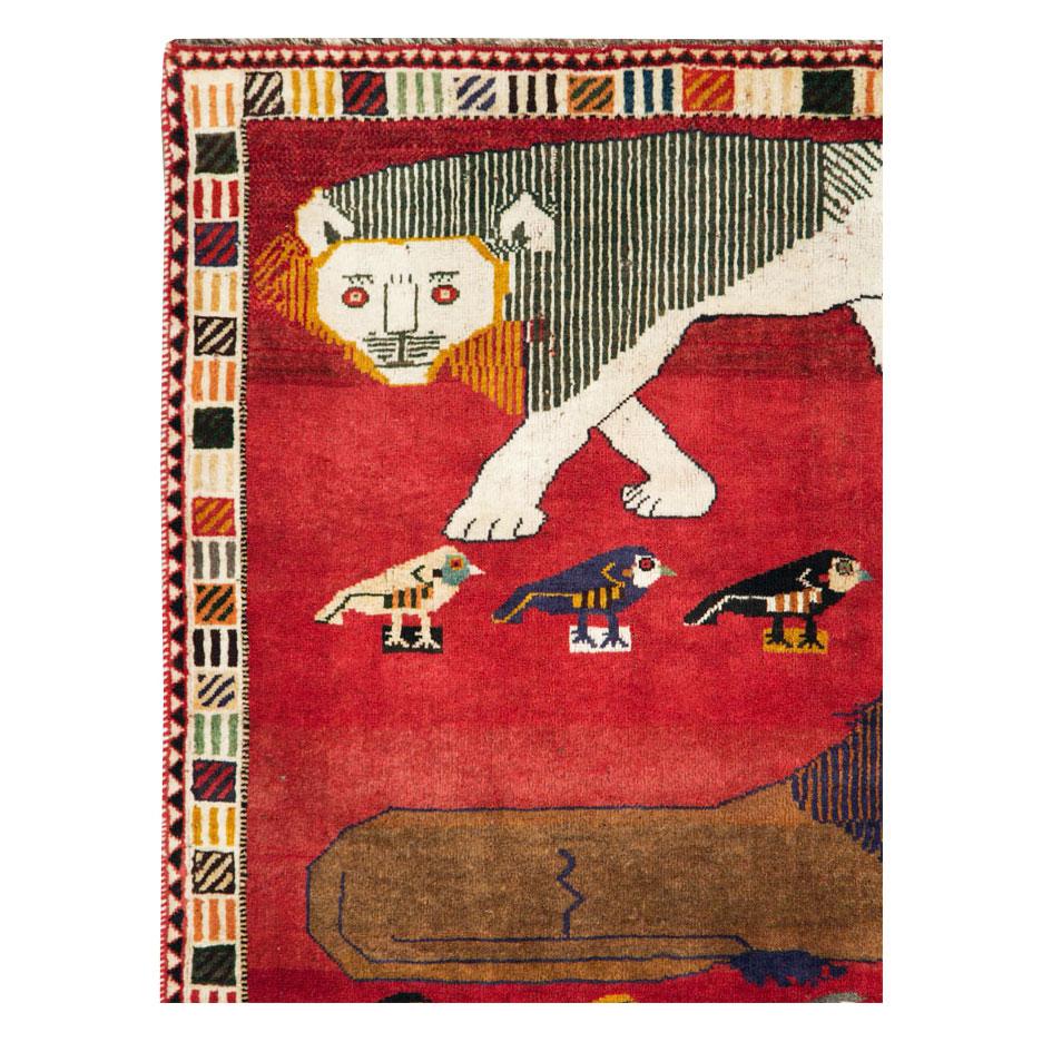 A vintage Persian Gabbeh pictorial accent rug handmade during the late 20th century.

Measures: 4' 1