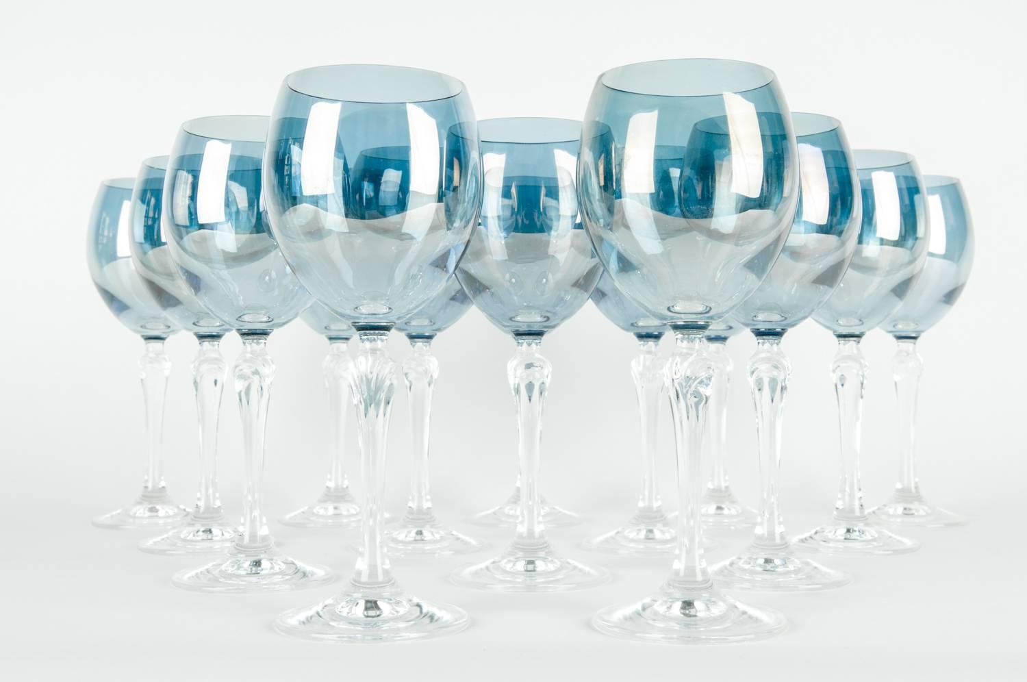 Late 20th century iridescent blue crystal wine / water glassware set of 12 pieces. Each glass is in excellent condition, each one measure about 8 inches high X 2.5 inches bottom diameter.
