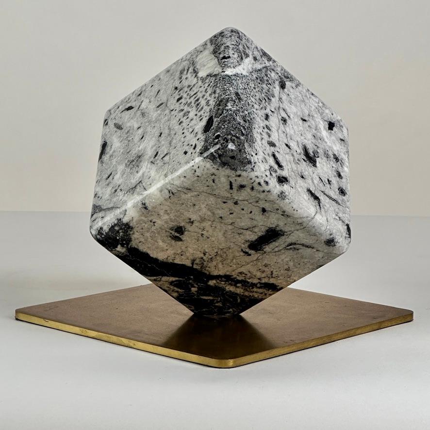 Curious Black & White Sculptural Ready Made Marble Object. This very decorative cube with a solid brass squared basement can be faced in a variety of different positions and renew its image every day dipending upon the side that you choose. Great
