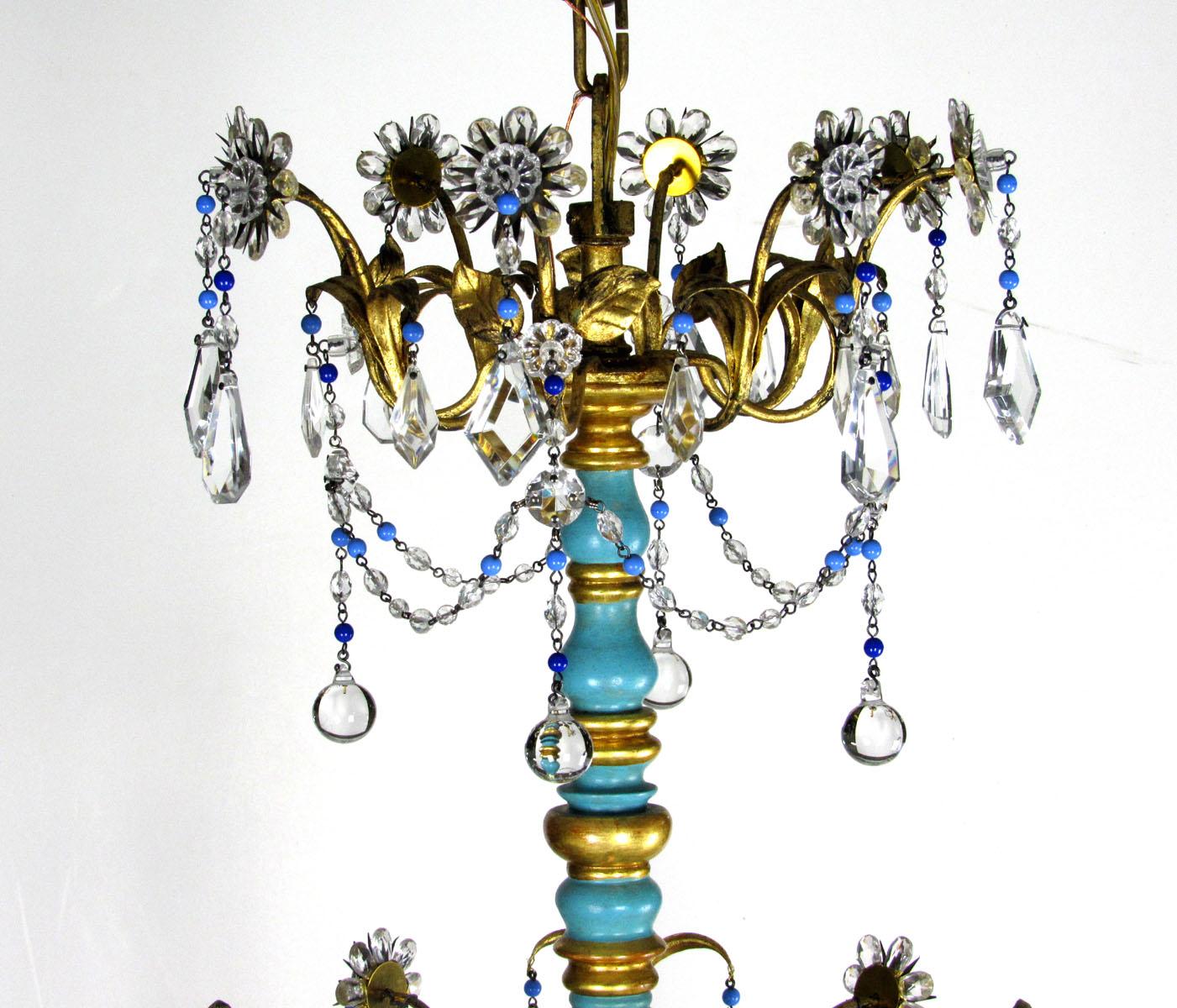 Late 20th century Italian eight-light chandelier with turned, turquoise painted wooden break, crystal drops and colored bead garlands.