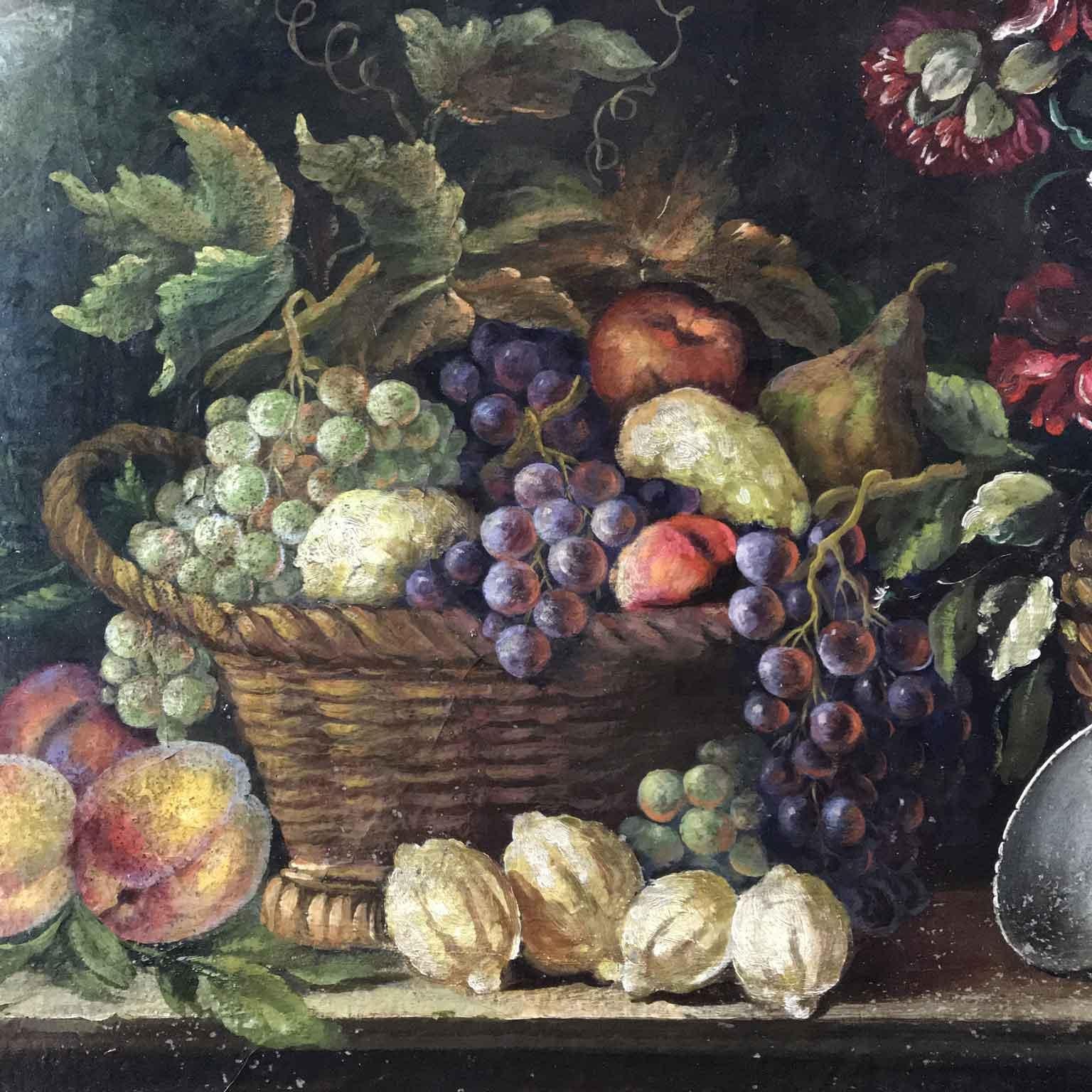 Decorative still life of flowers and fruit, an Italian oil on canvas painting, in good condition, set within a mecca giltwood frame with floral engraving, this classical style painting comes from a private collection of Milan and dates back to circa