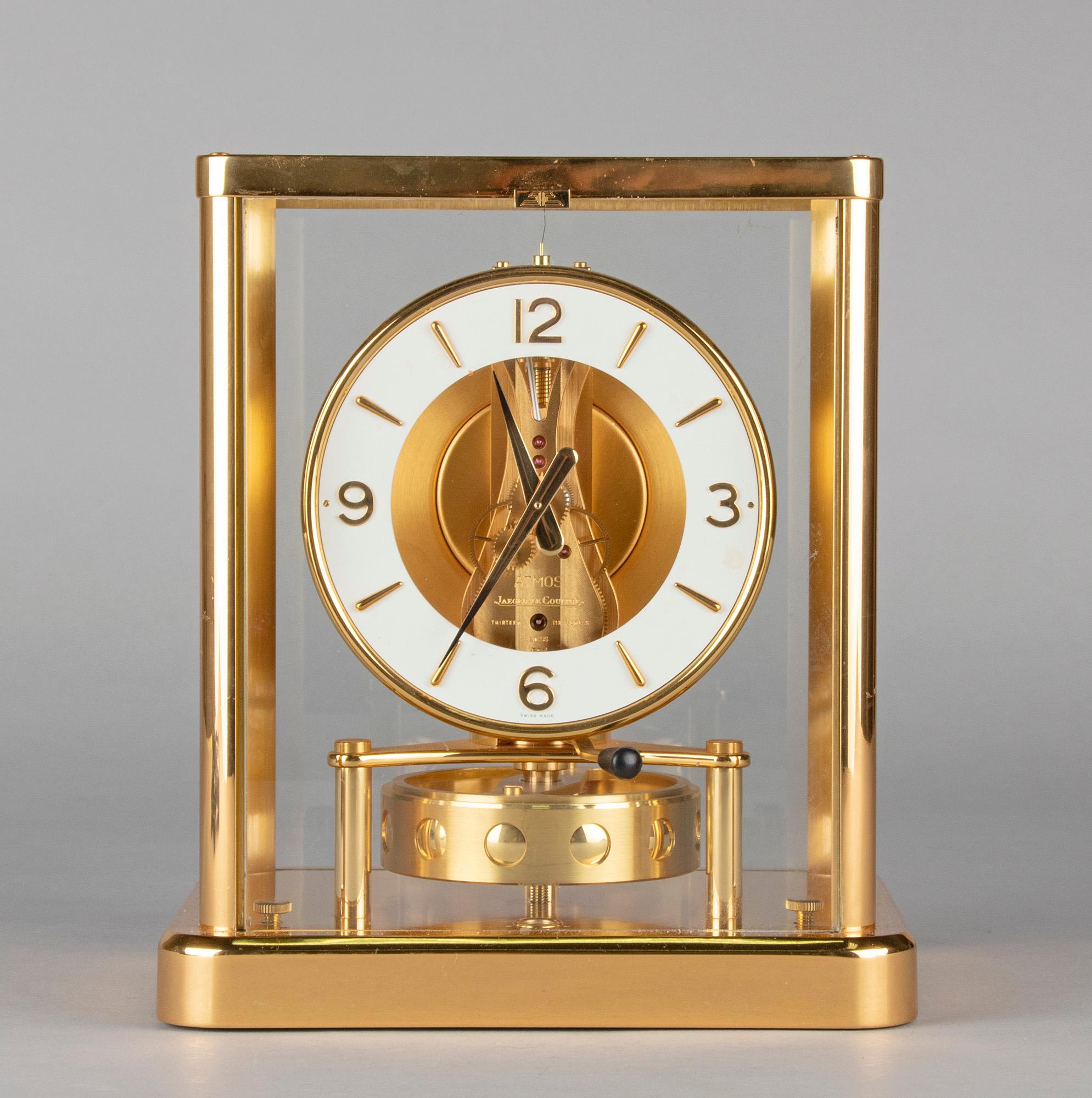 Perpetual Motion clock with a glass case framed in brass made by Jaeger Lecoultre, Switserland. Model 540 Elysee. The Atmos is the only timepiece in the word defined as a 'perpetual motion' clock. This is because it doesn't need electricity or