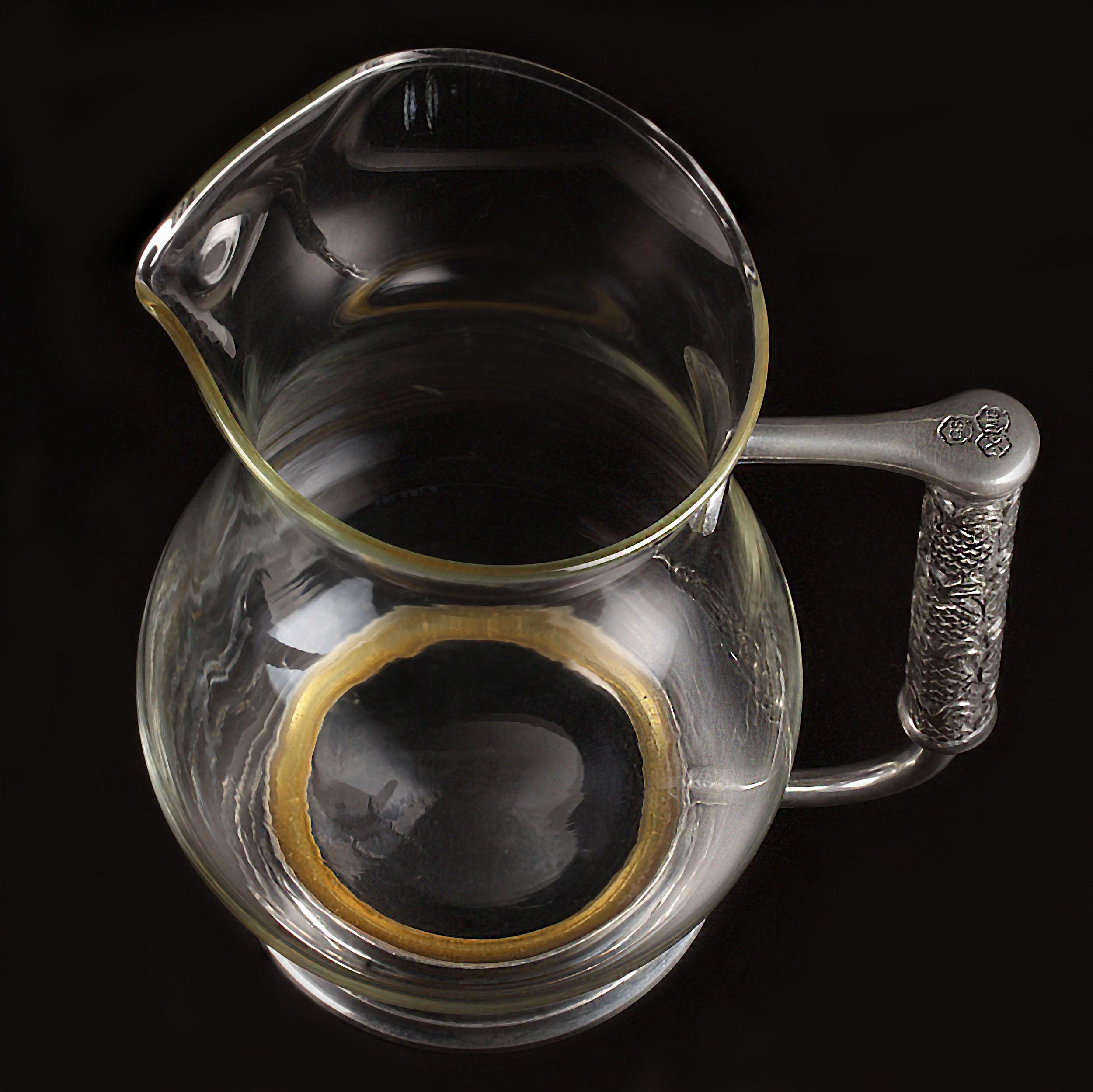 John Somers Brazilian Pewter ‘Jarra de Cristal’ Pitcher

Dimensions: 7 inches tall
Material:
Crystal-clear glass body for a sleek and timeless look
Sturdy Brazilian pewter handle and footed base
Design Highlights:
Footed base ensures stability and