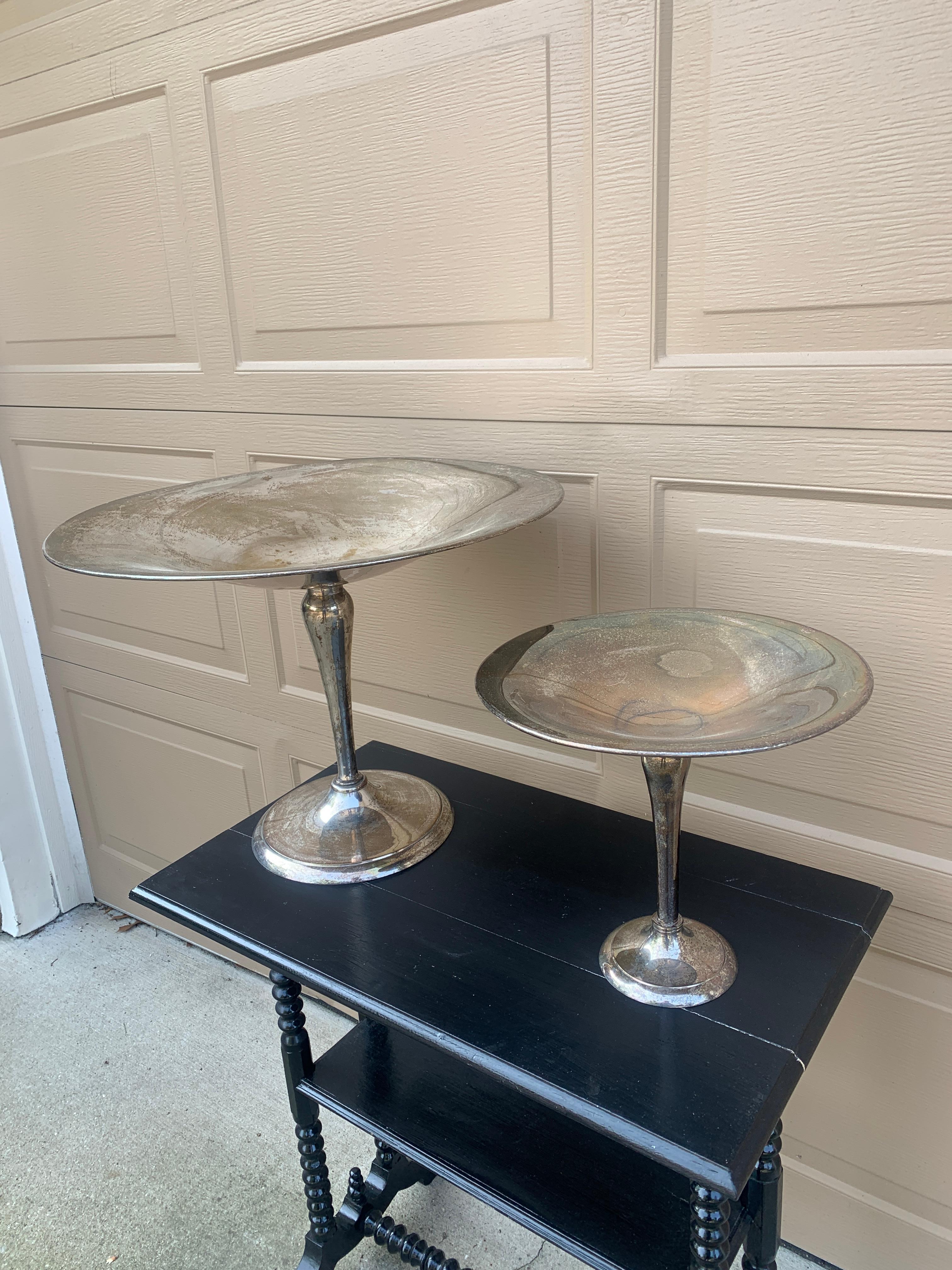 A gorgeous pair of large silver plate compotes

USA, Late 20th Century

Largest measures: 20