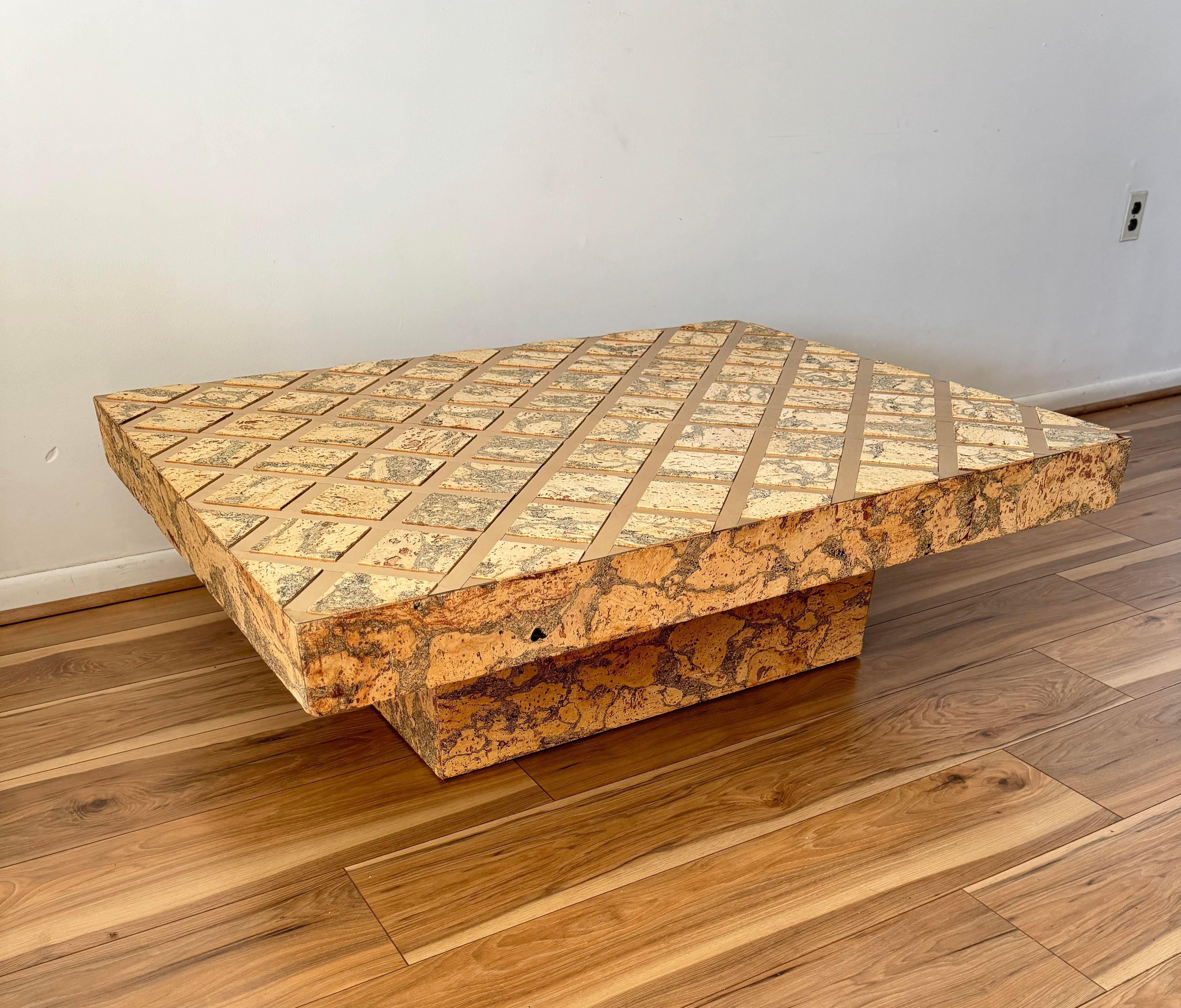 This gorgeous vintage cork coffee table captures attention through the compelling contrast between the natural, earthy texture of cork and the pronounced luxury of the golden inlay.
The stark contrast between these elements creates a captivating