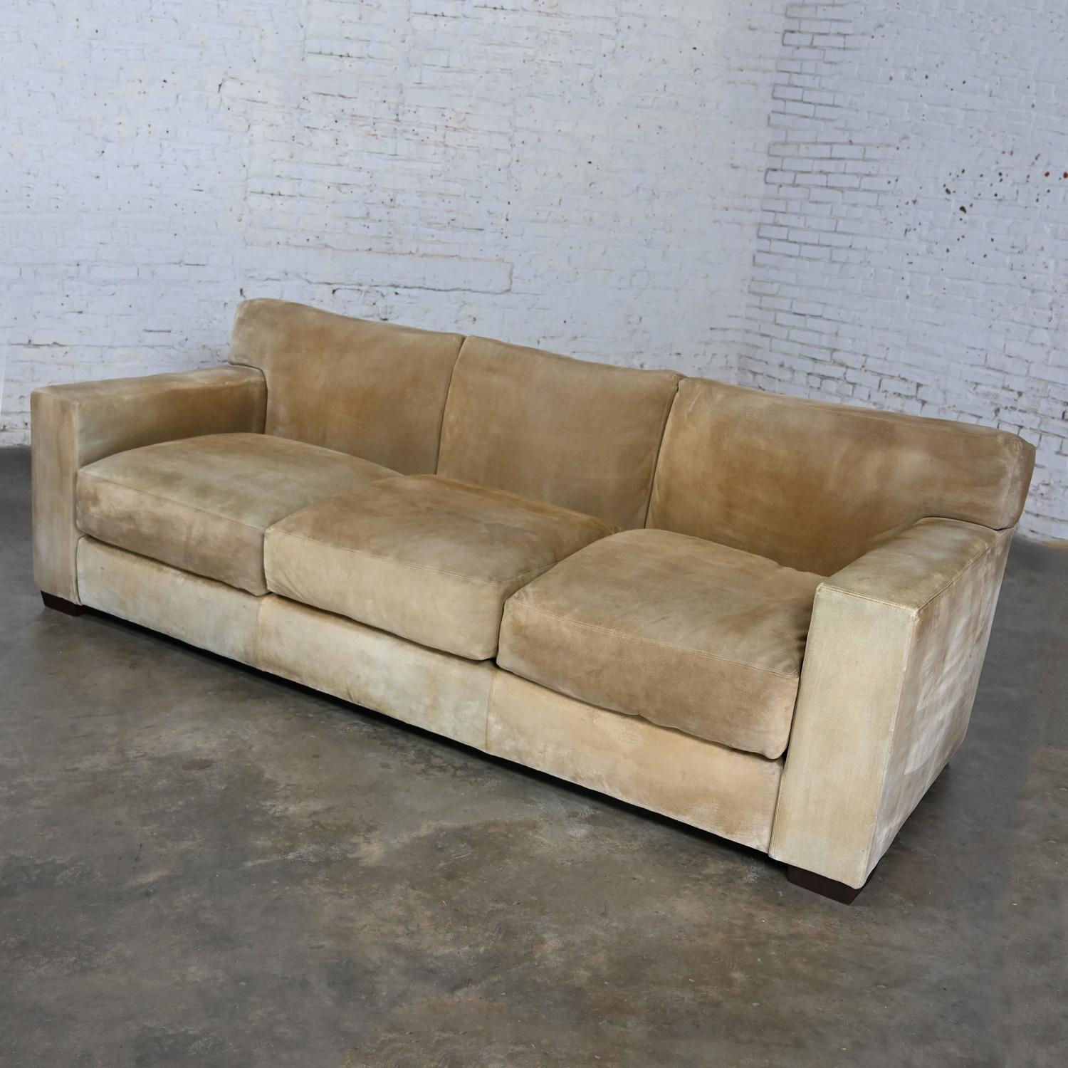 Marvelous vintage Lawson style sofa original buff suede leather by Ralph Lauren for Henredon. Three loose seat cushions comprised of 50% duck feather down & 50% polyester, sectioned tight back with T back cushions, and tapered block wood legs.