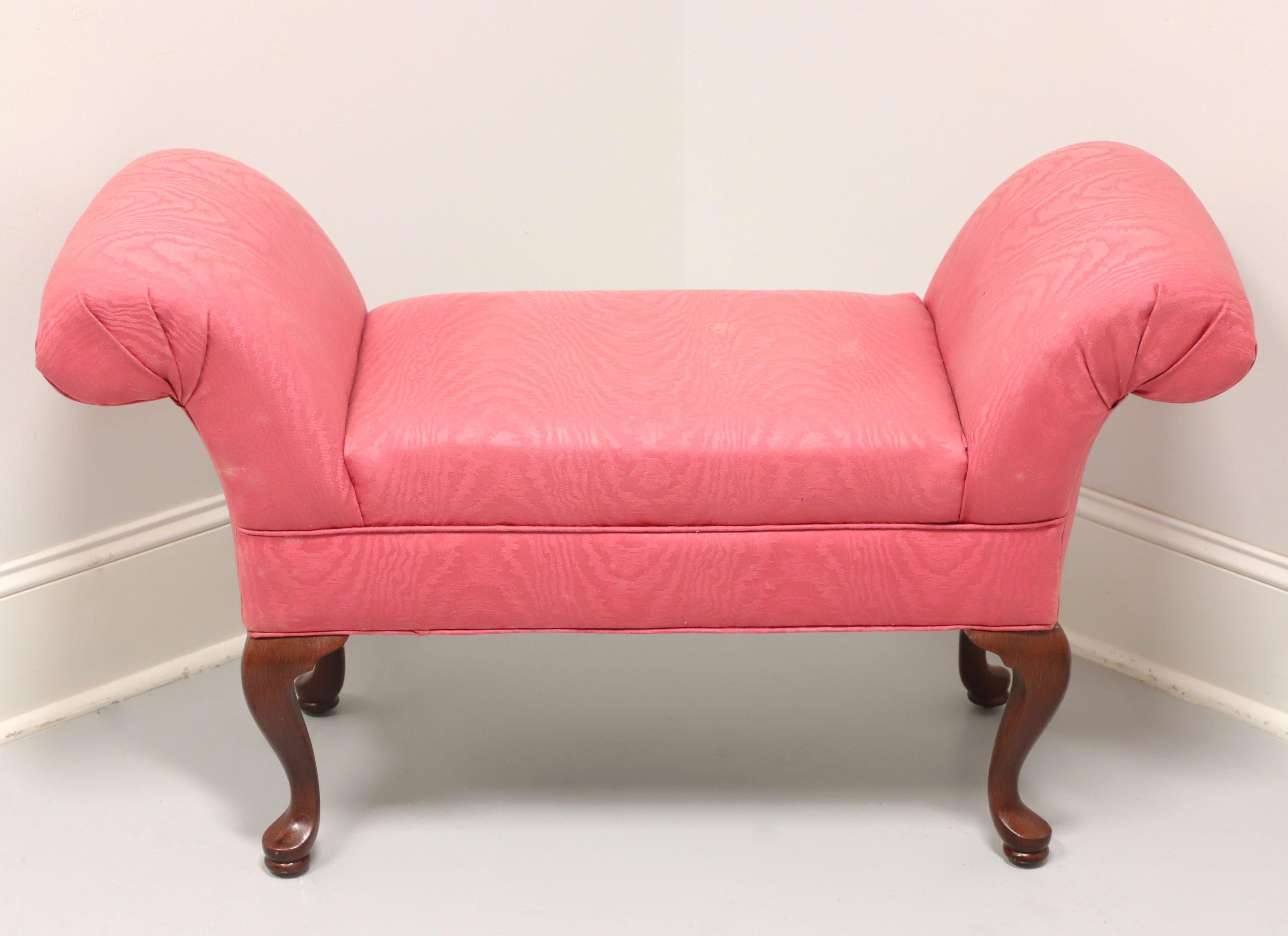 A rolled arm upholstered bench in the Queen Anne style, unbranded. Mahogany frame, rolled arms, pink color flame fabric upholstery, cabriole legs and pad feet. Made in the USA, in the late 20th Century.

Measures: Overall: 42.5w 18d 24.25h, Seat:
